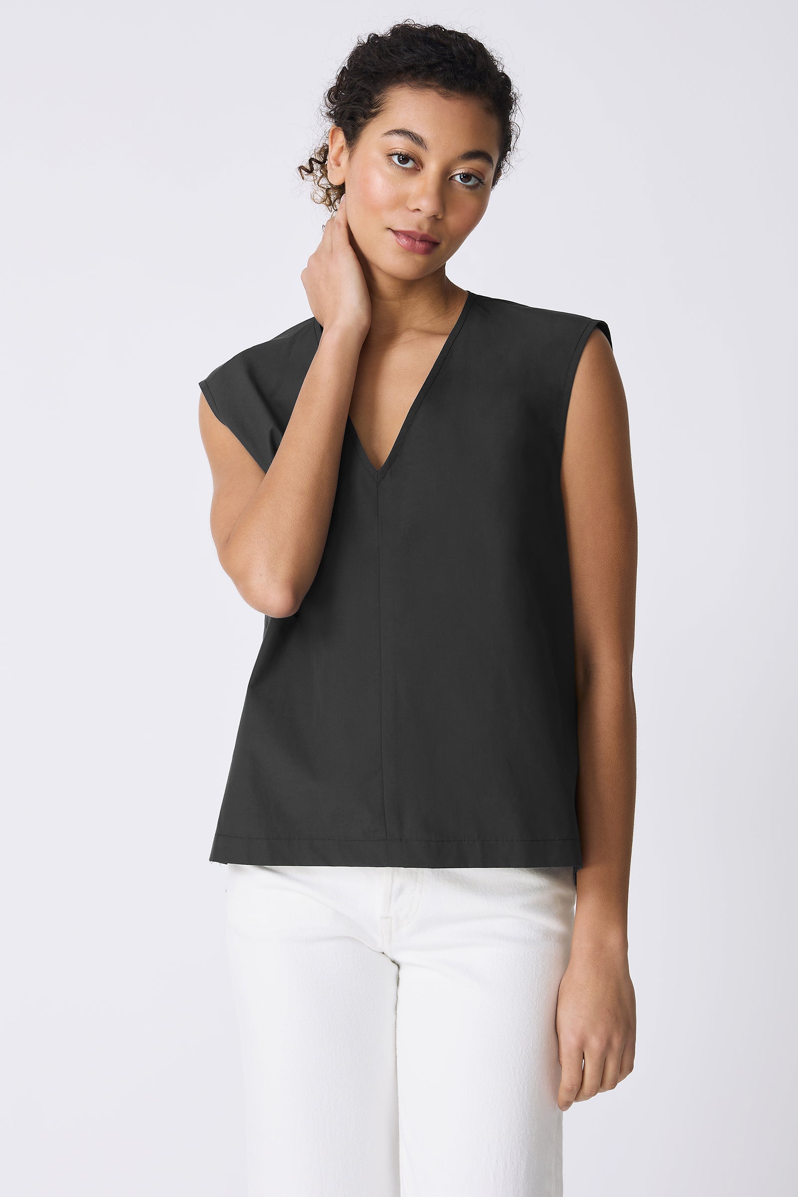 Kal Rieman Ava V-Neck Shell in Black on model touching neck front view