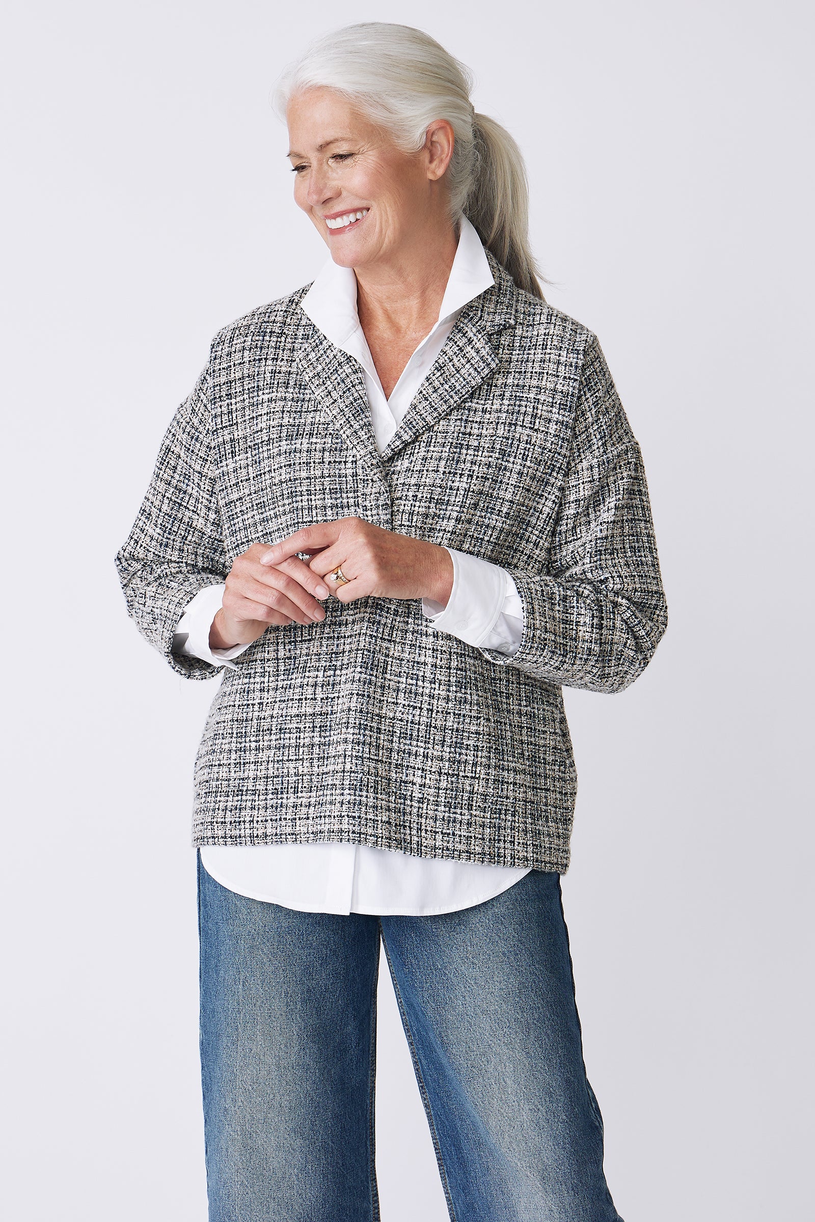 Kal Rieman Elaine Notch Collar Pullover in Spanish Multi Tweed on Model Main Front View hands touching
