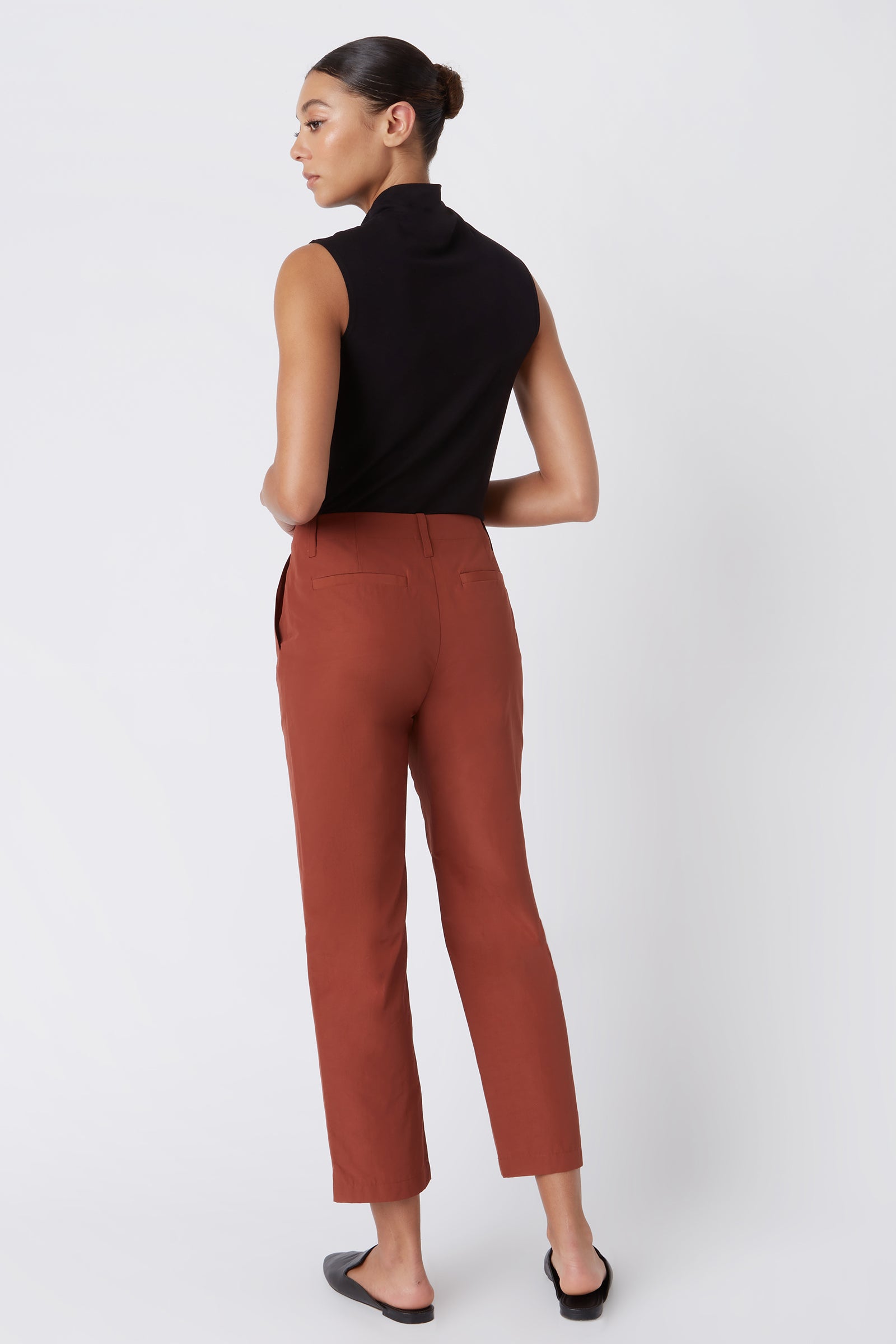 Kal Rieman Francoise Cigarette Pant in Rust Italian Broadcloth on Model with Hands in Pockets Full Front Side View