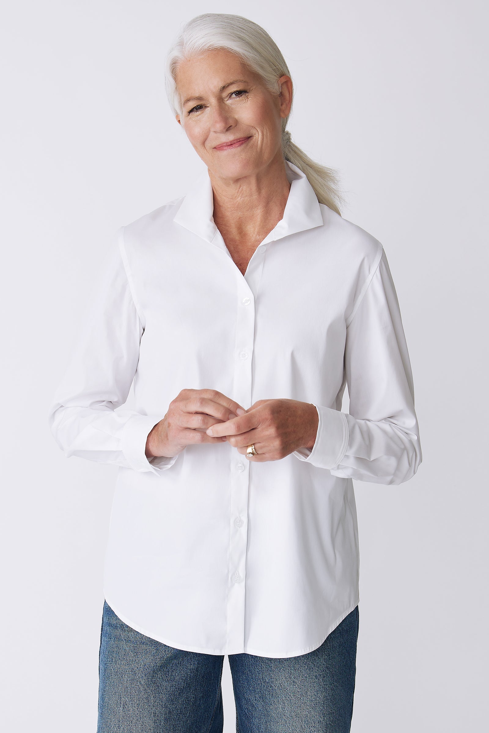 Kal Rieman Ginna Box Pleat Shirt in White Stretch on Model Front view hands touching