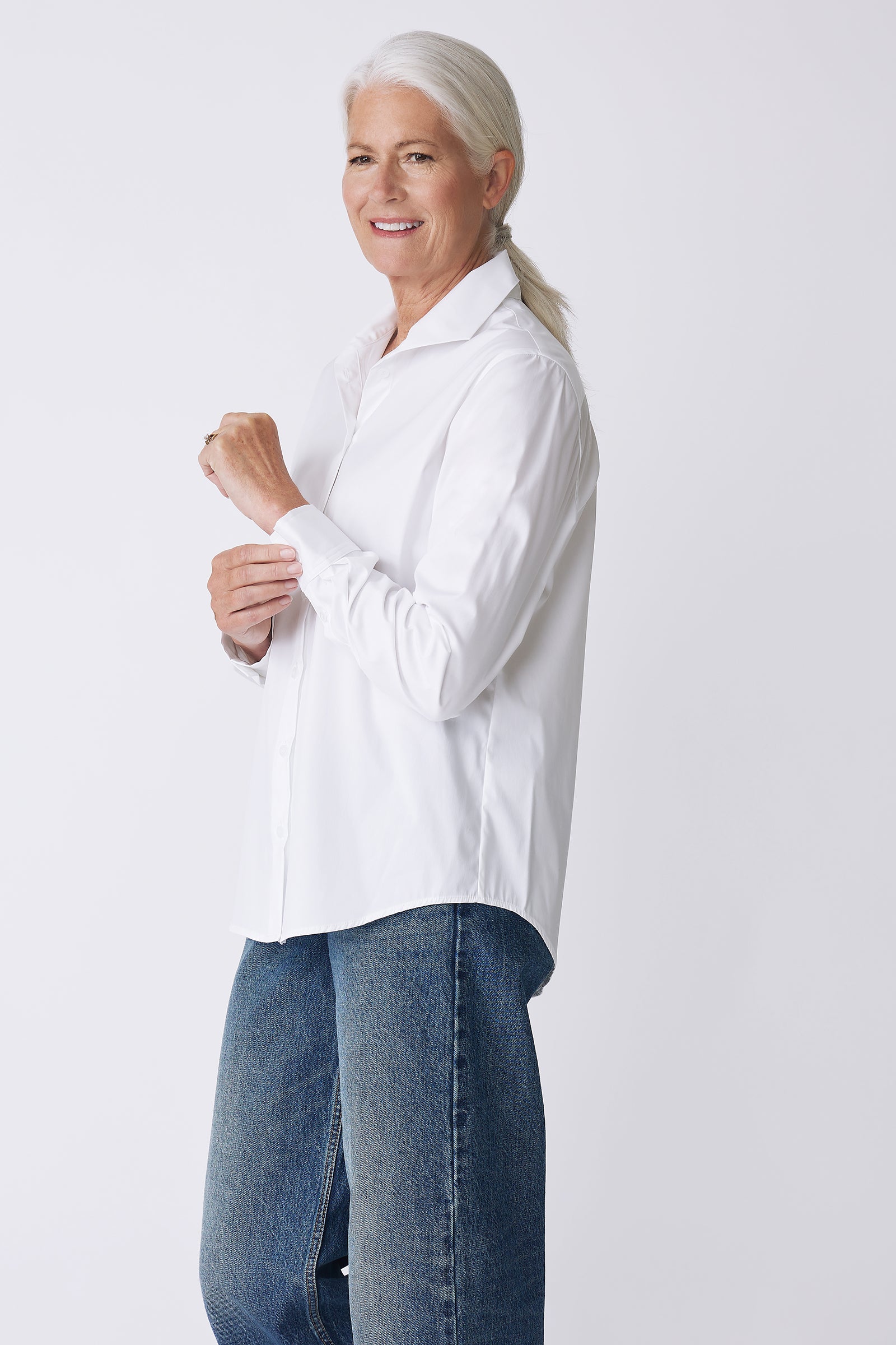 Kal Rieman Ginna Box Pleat Shirt in White Stretch on Model side view holding cuff