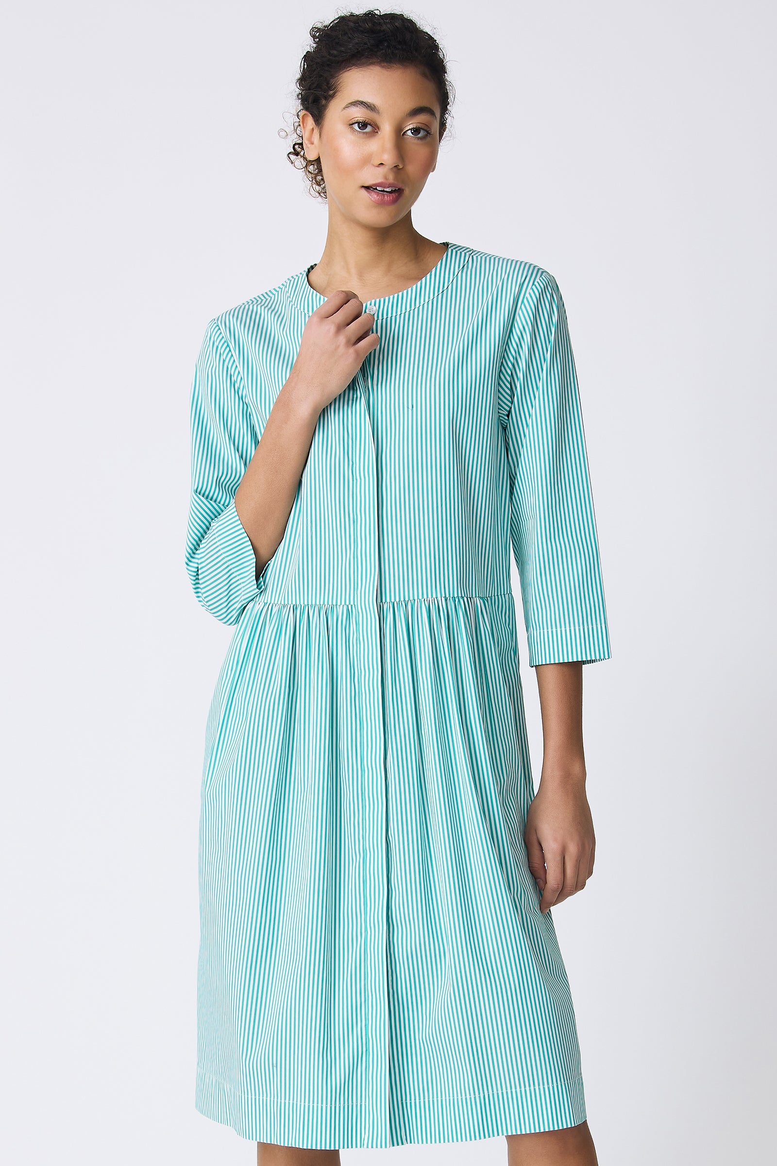 Kal Rieman Abby Shirt Dress in Miami Stripe Green on model touching collar front view