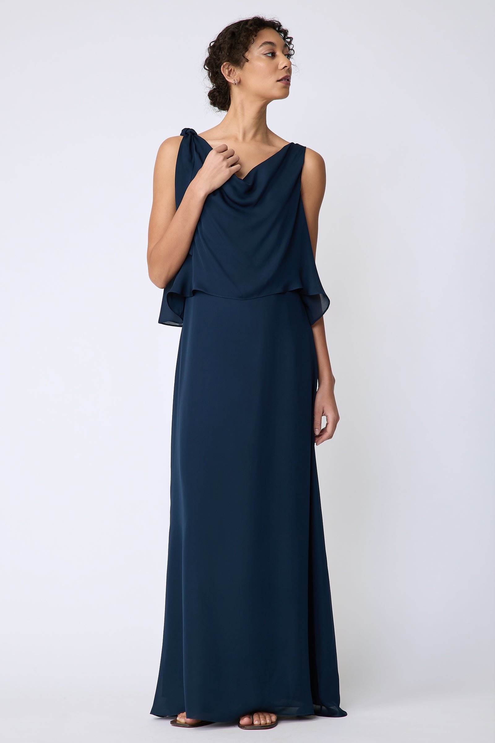 Kal Rieman Ada Gown in navy silk georgette on model front view holding neckline