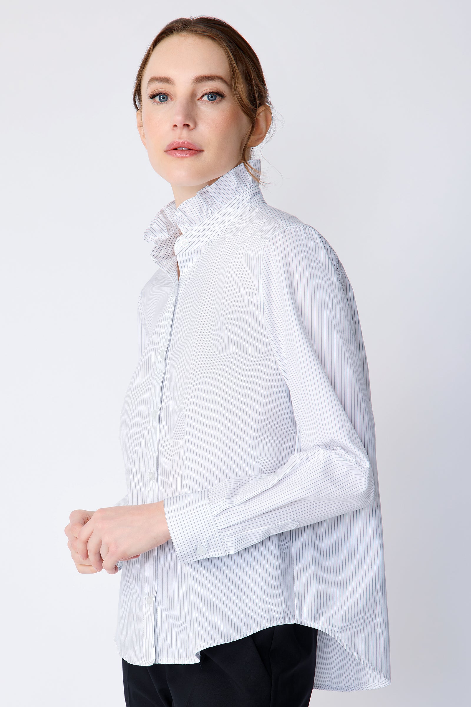 Kal Rieman Amy Ruffle Collar Shirt on model side view hands in front