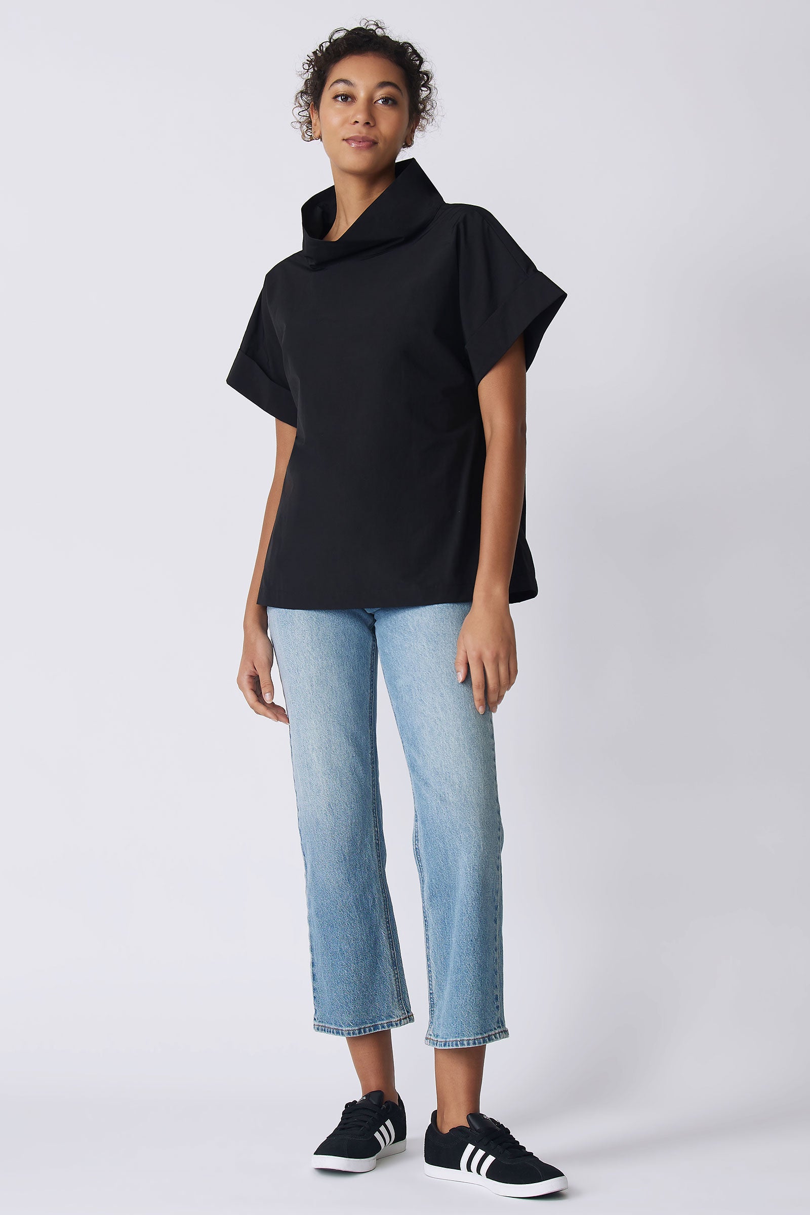Kal Rieman Ary Cuffed Kimono Tee in black broadcloth on model front view with hand at side