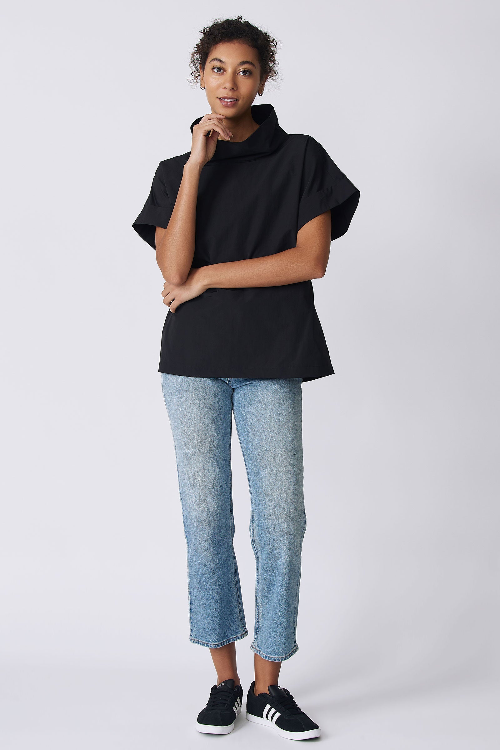Kal Rieman Ary Cuffed Kimono Tee in black broadcloth on model front view with hand on face