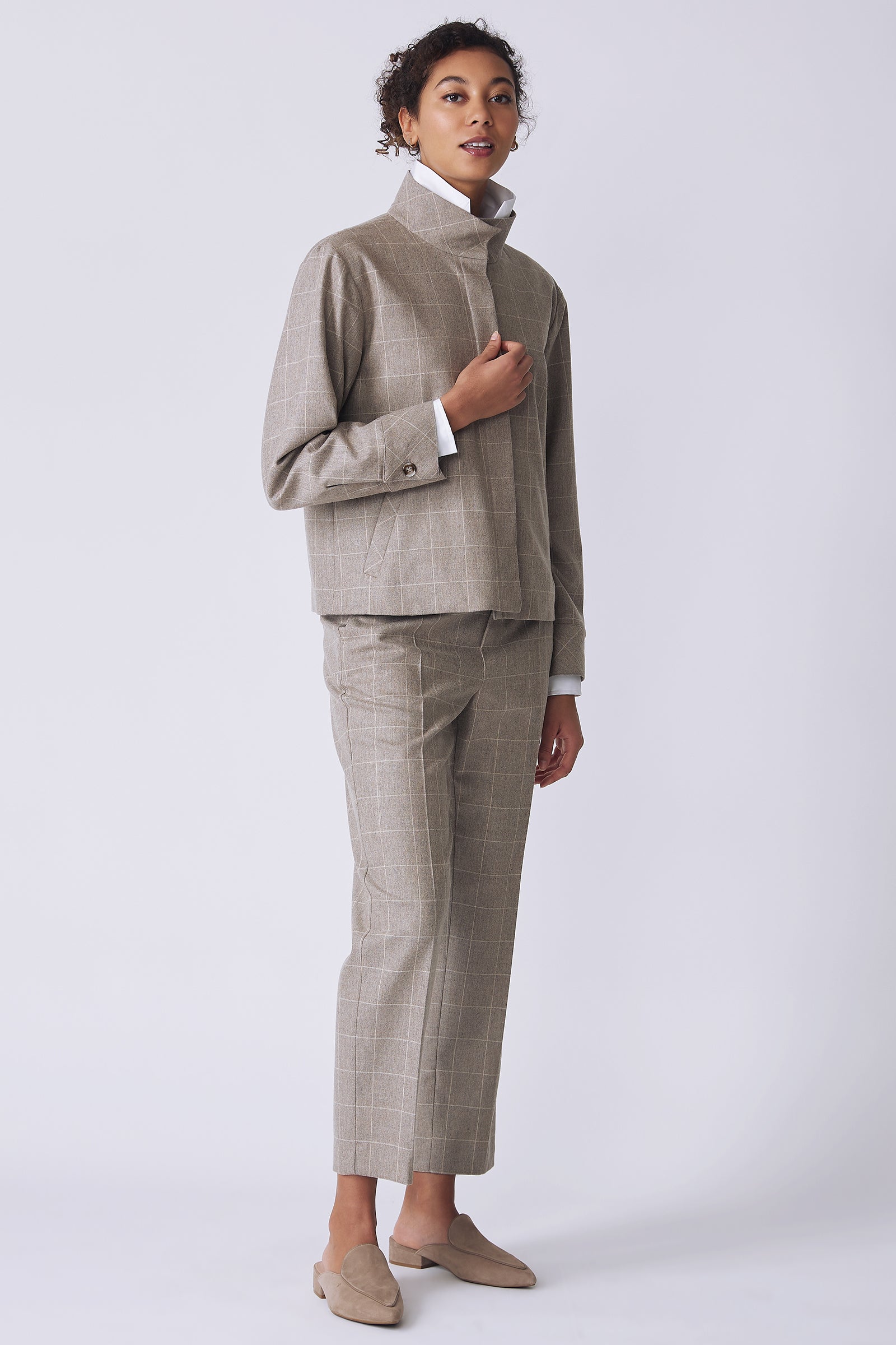 Kal Rieman Ashton Jacket in Italian Windowpane on model side view holding front of jacket full view