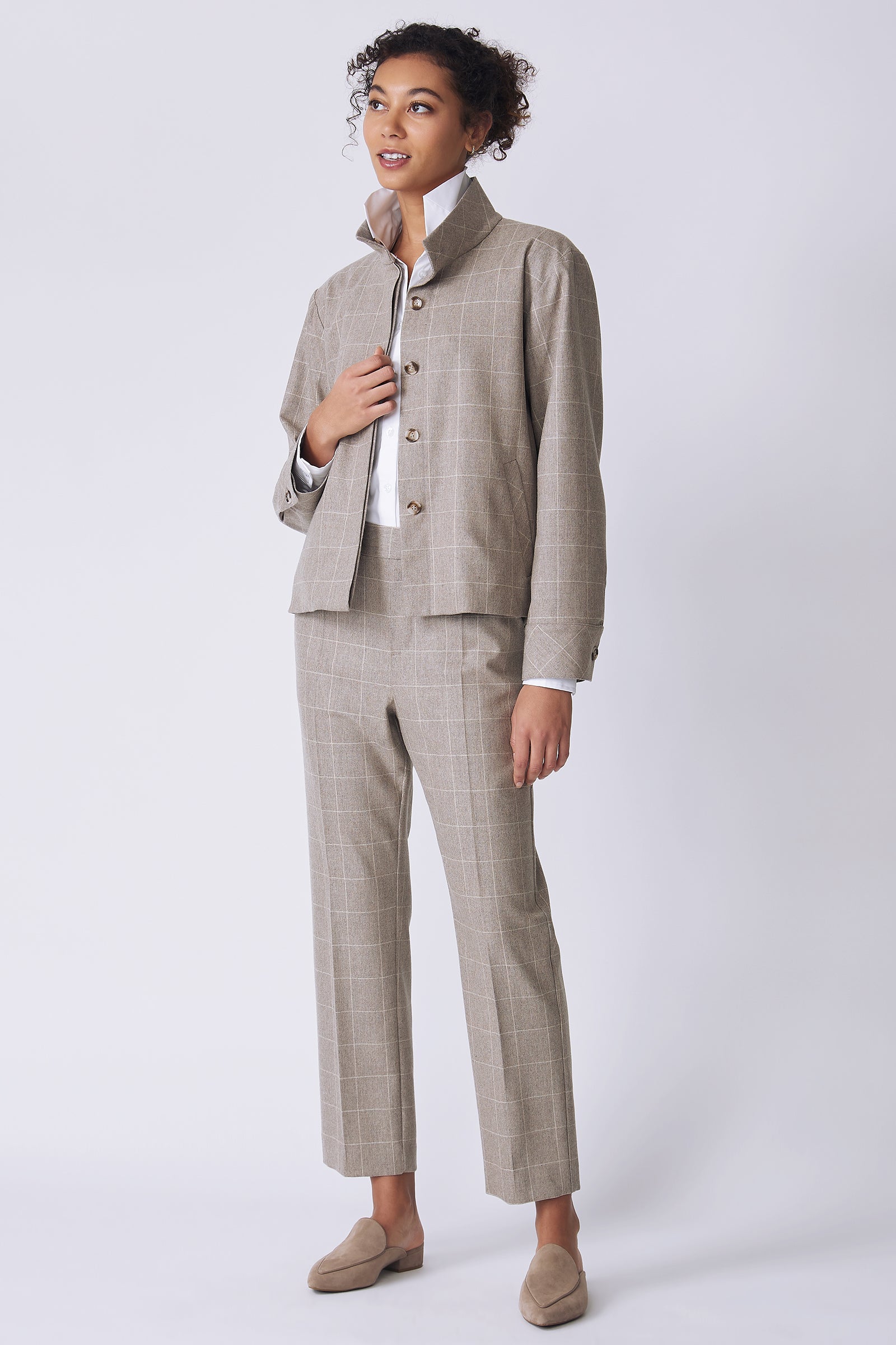 Kal Rieman Ashton Jacket in Italian Windowpane on model side view holding front of jacket