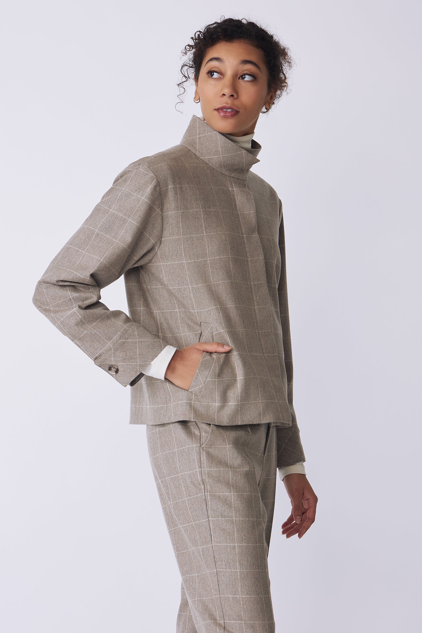 Kal Rieman Ashton Jacket in Italian Windowpane on model side view with hand in pocket