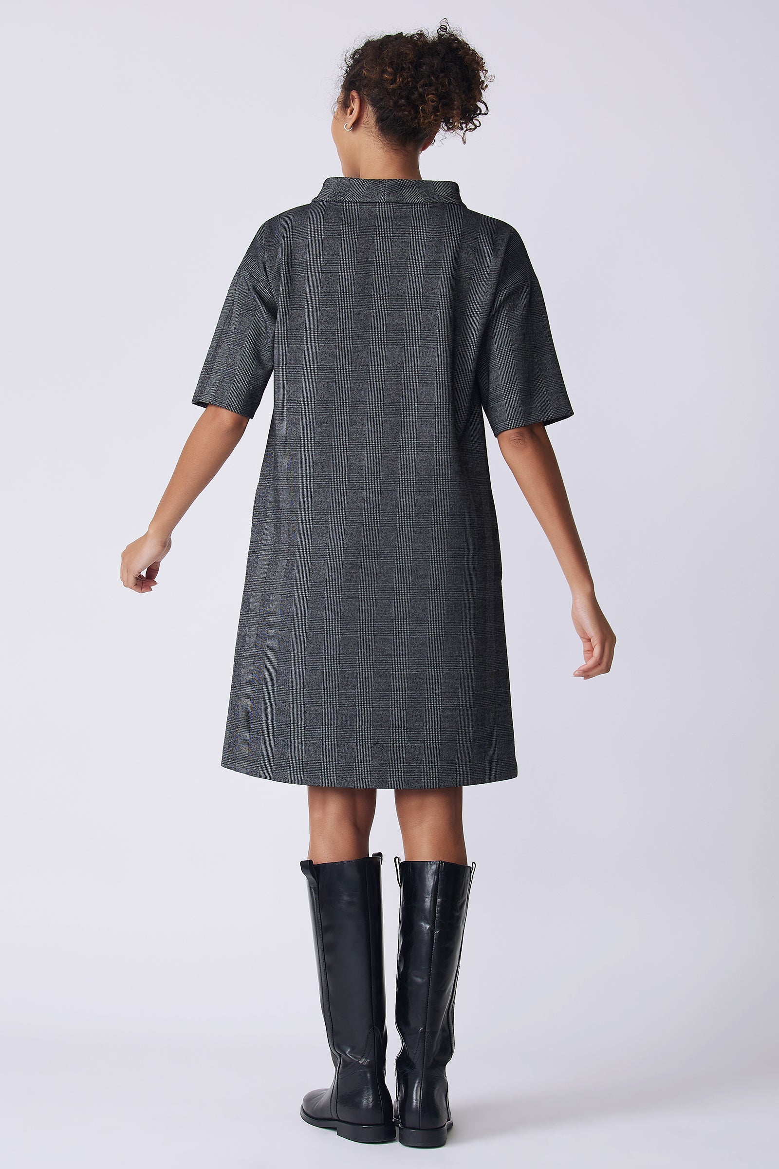Kal Rieman Avery Dress in black plaid on model back view hands extended