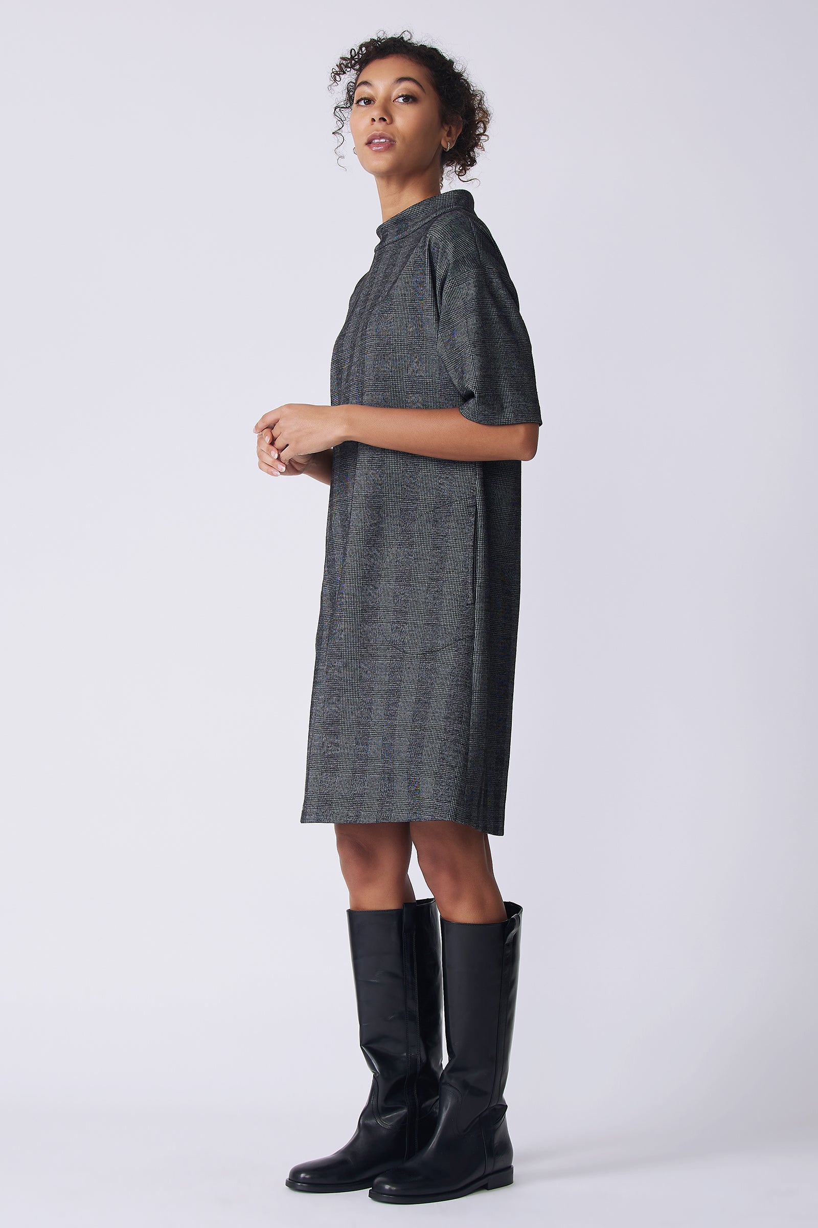Kal Rieman Avery Dress in black plaid on model side view full holding hands