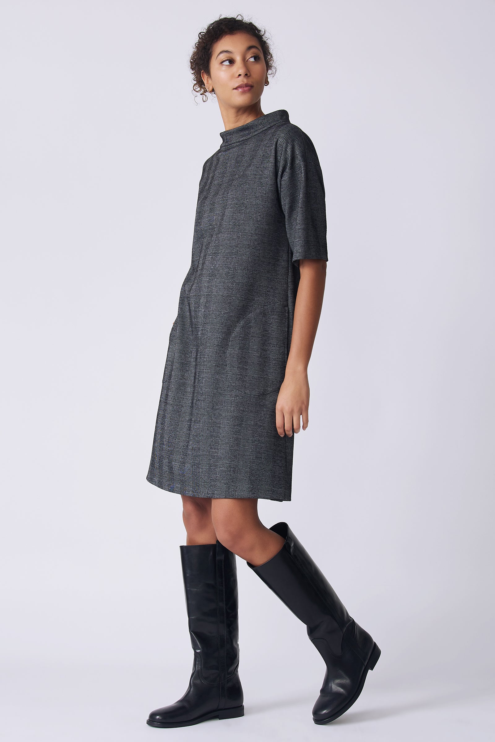 Kal Rieman Avery Dress in black plaid on model side view walking