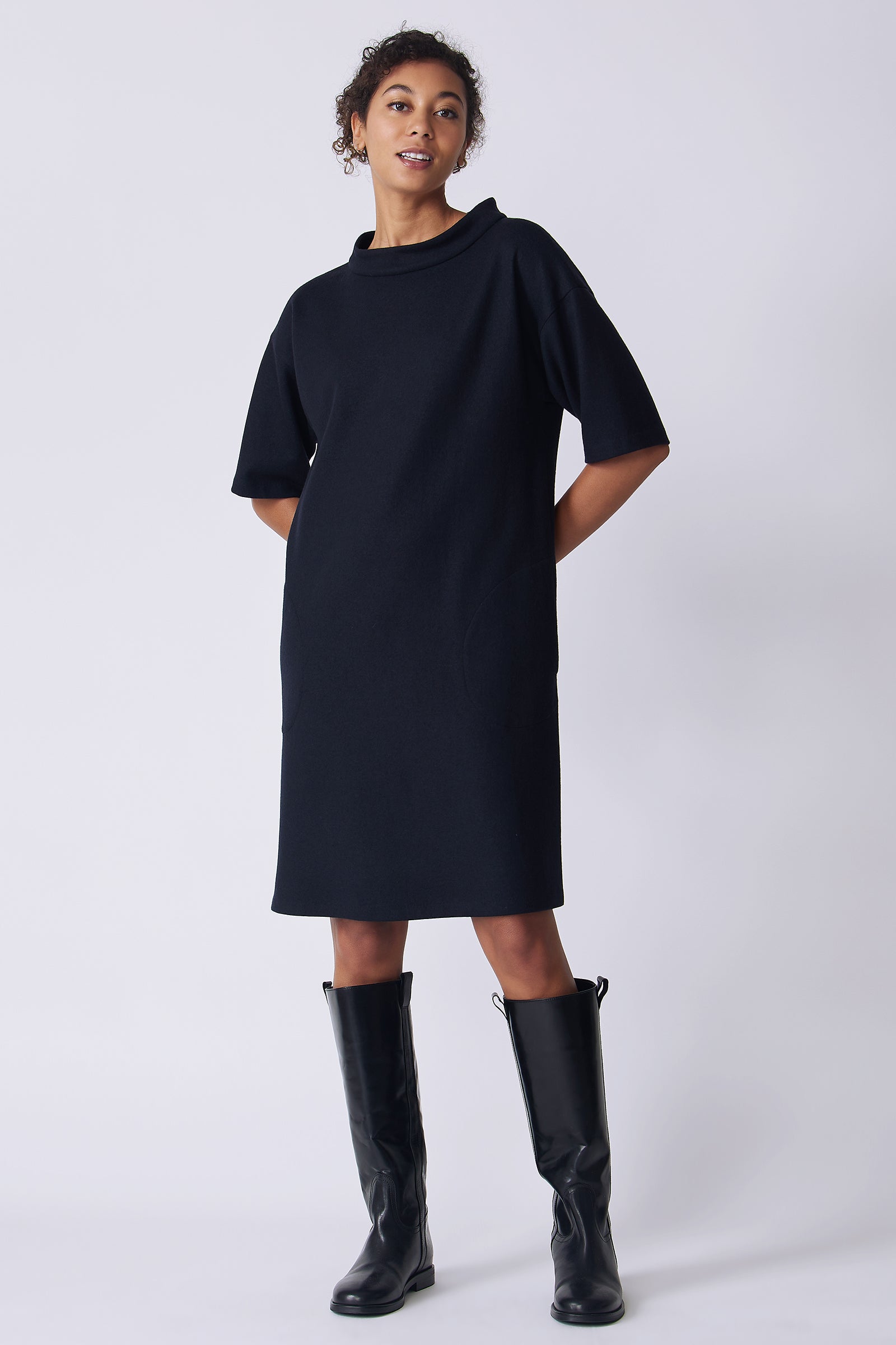 Kal Rieman Avery Dress in midnight felted jersey on model front view hands behind back