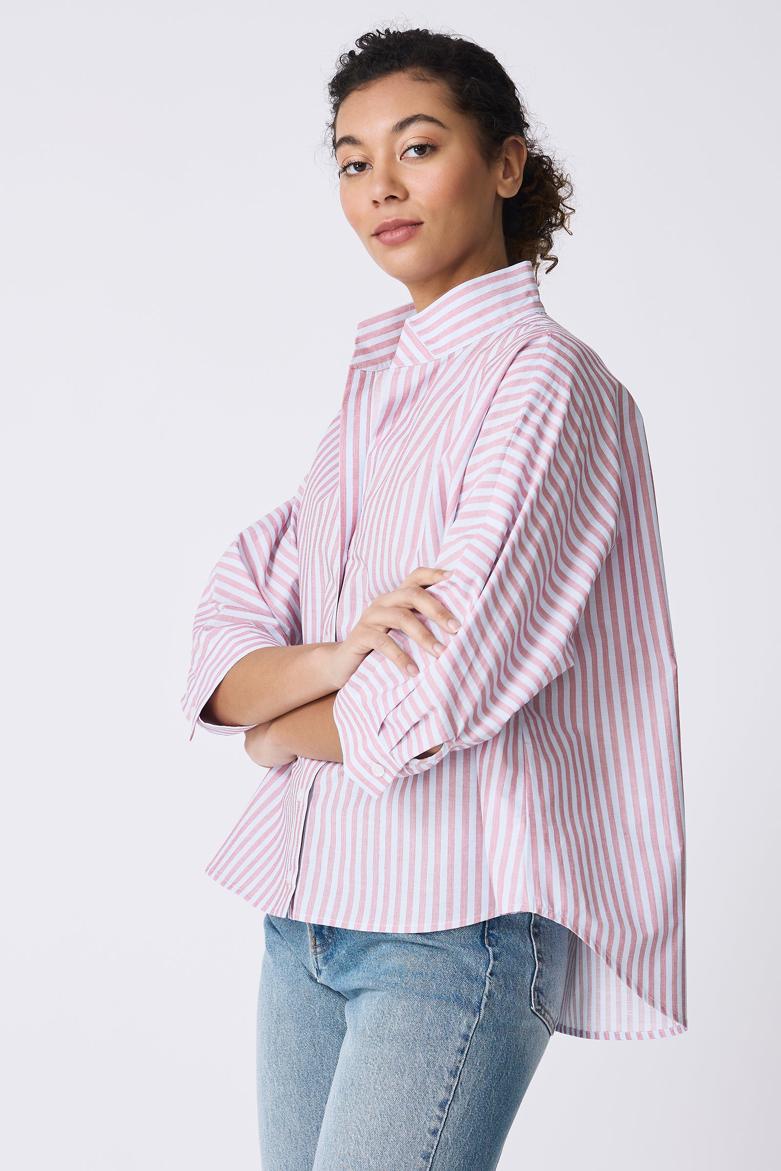 Kal Rieman Avi Shirt in Cabana Stripe Red on model with arms crossed side view