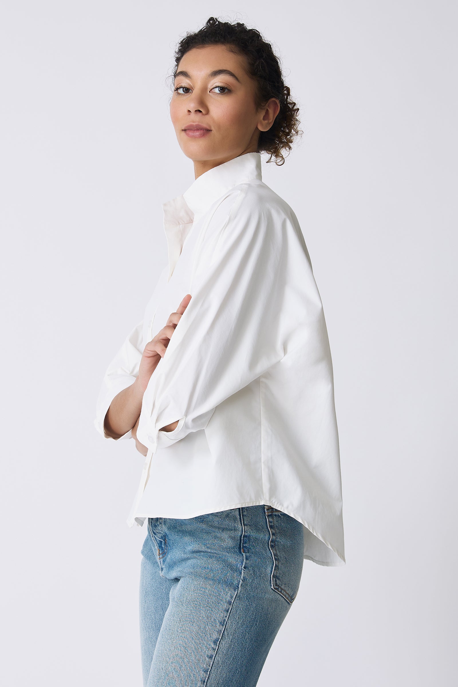 Kal Rieman Avi Shirt in Ecru on model with arms crossed side view