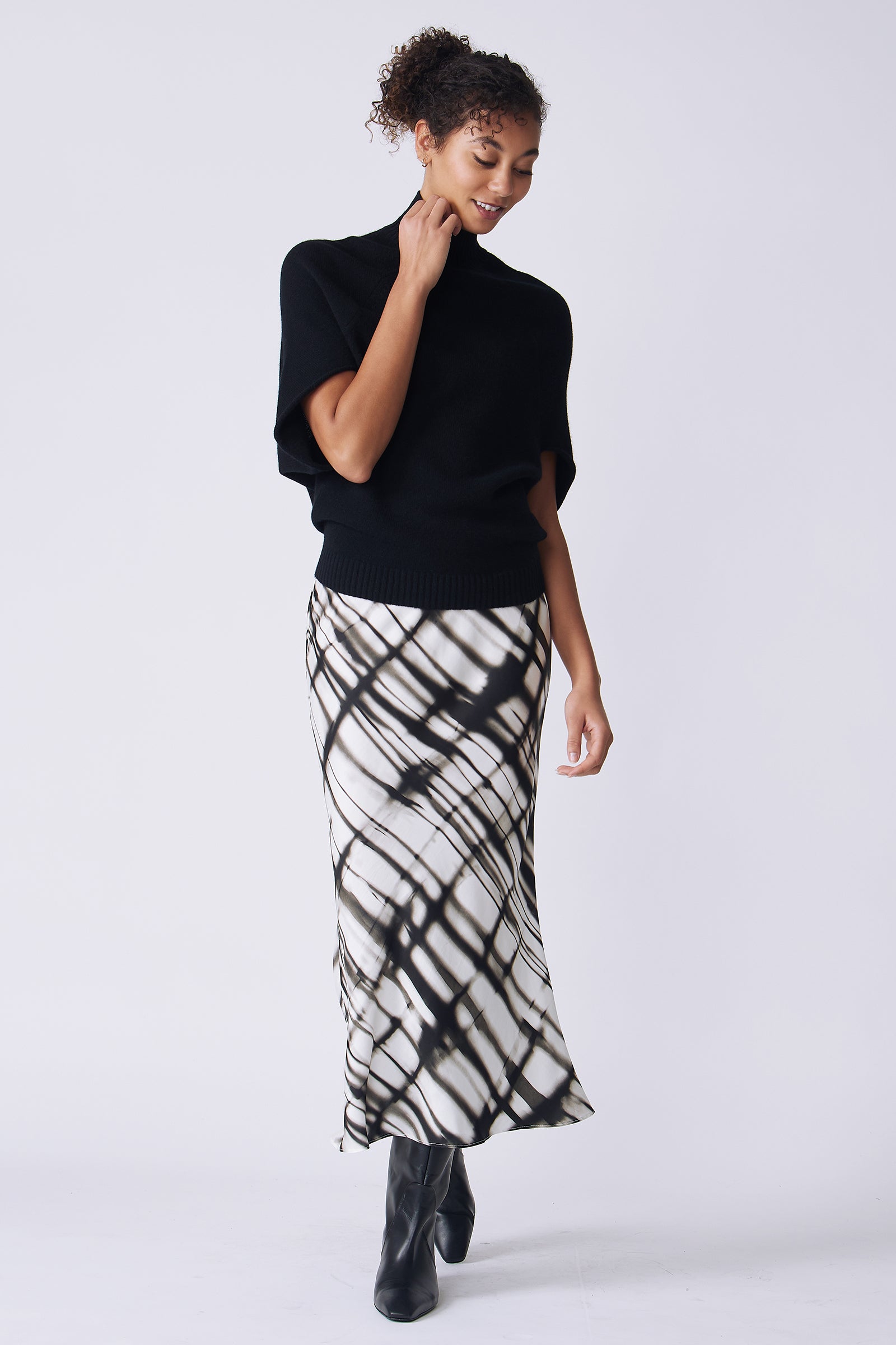Kal Rieman Bias silk skirt in watercolor print on model front view holding collar