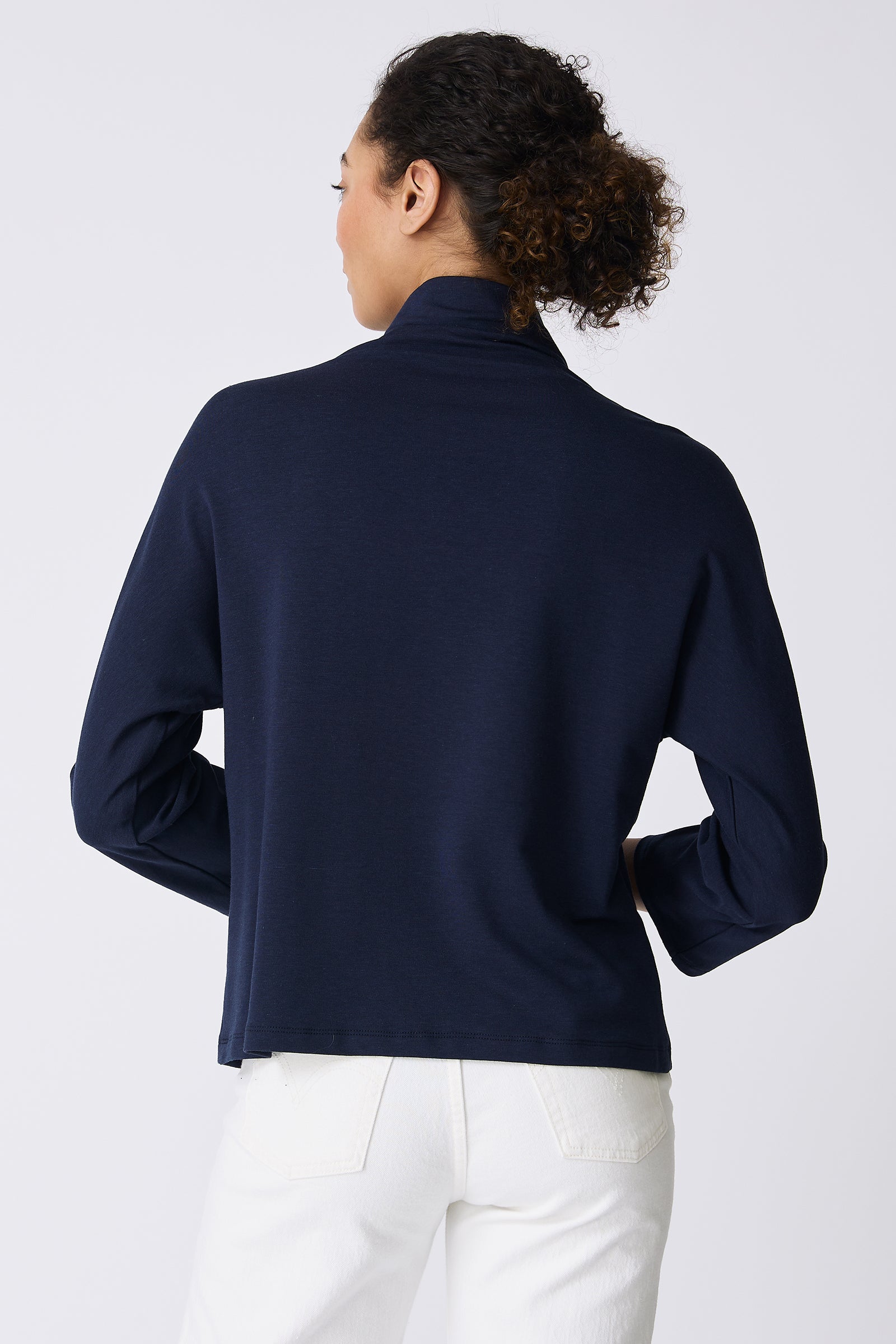 Kal Rieman Brigitte Mock Funnel in Navy on model touching shirt front view
