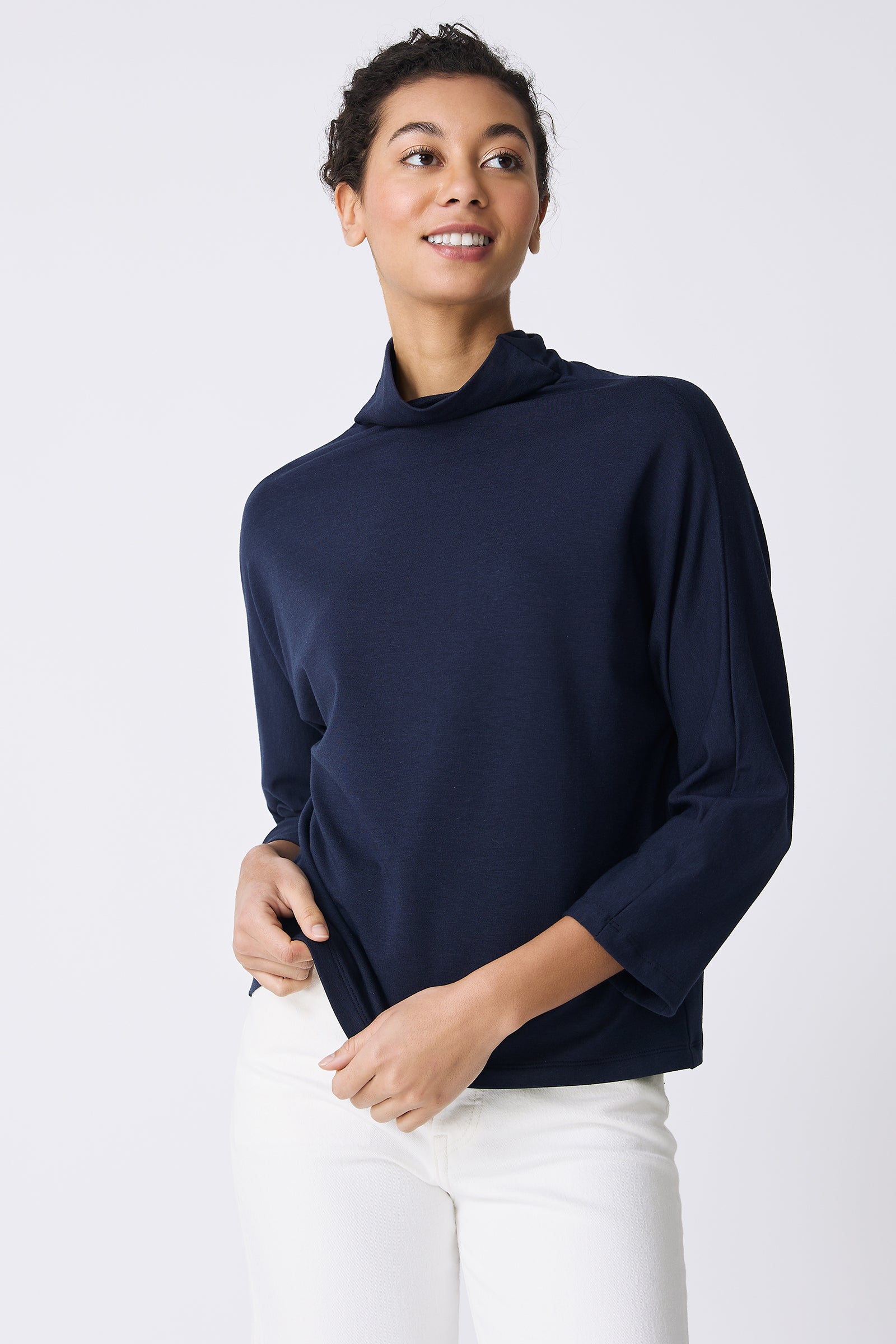 Kal Rieman Brigitte Mock Funnel in Navy on model touching shirt front view