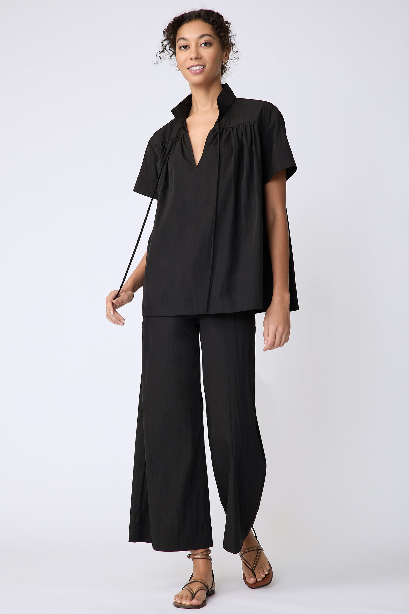 Kal Rieman Camille Top in black typewriter cloth on model front view walking