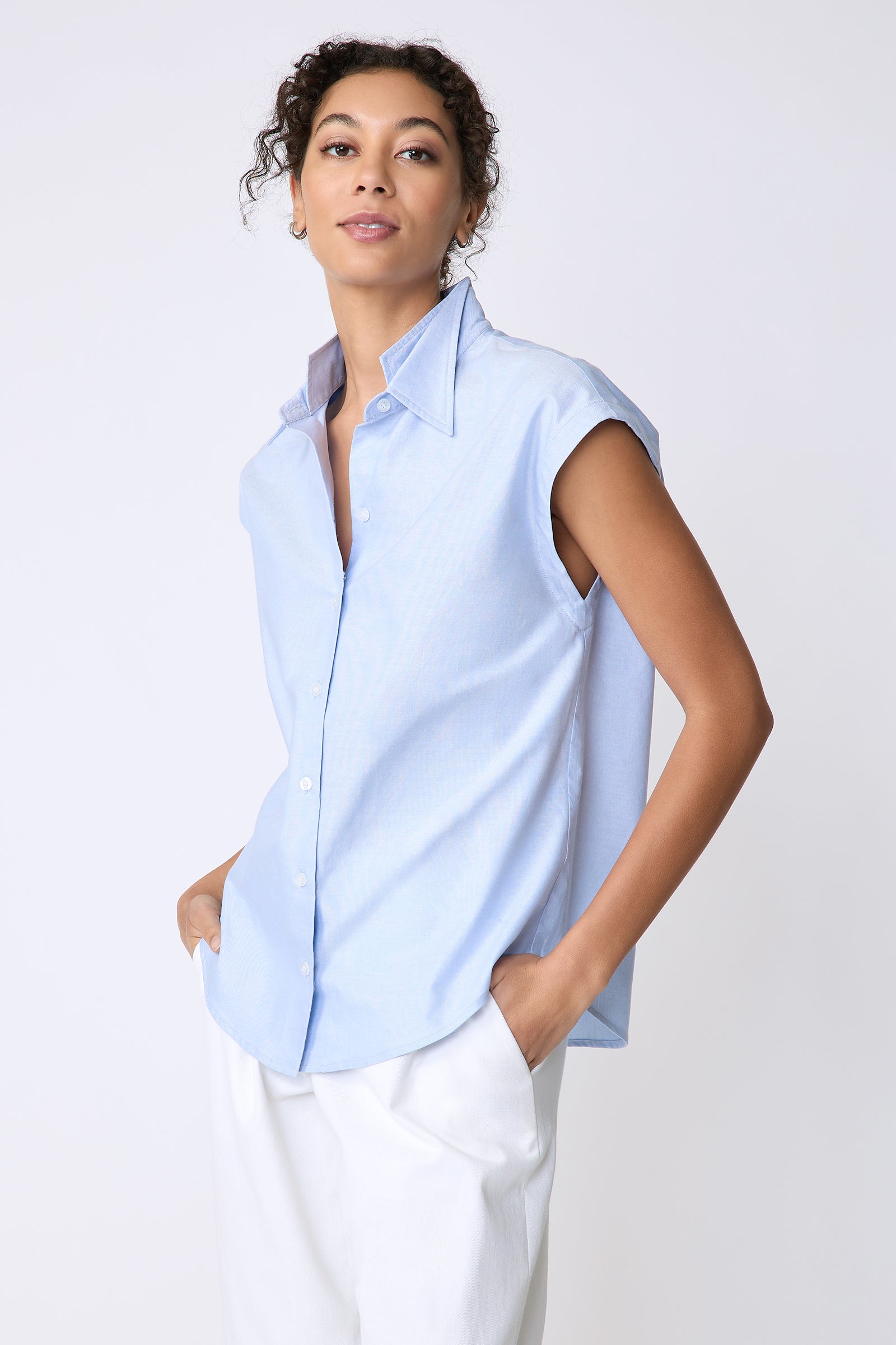 Kal Rieman Candice Cap Sleeve Double Collar Shirt in oxford blue on model front view hands in pockets
