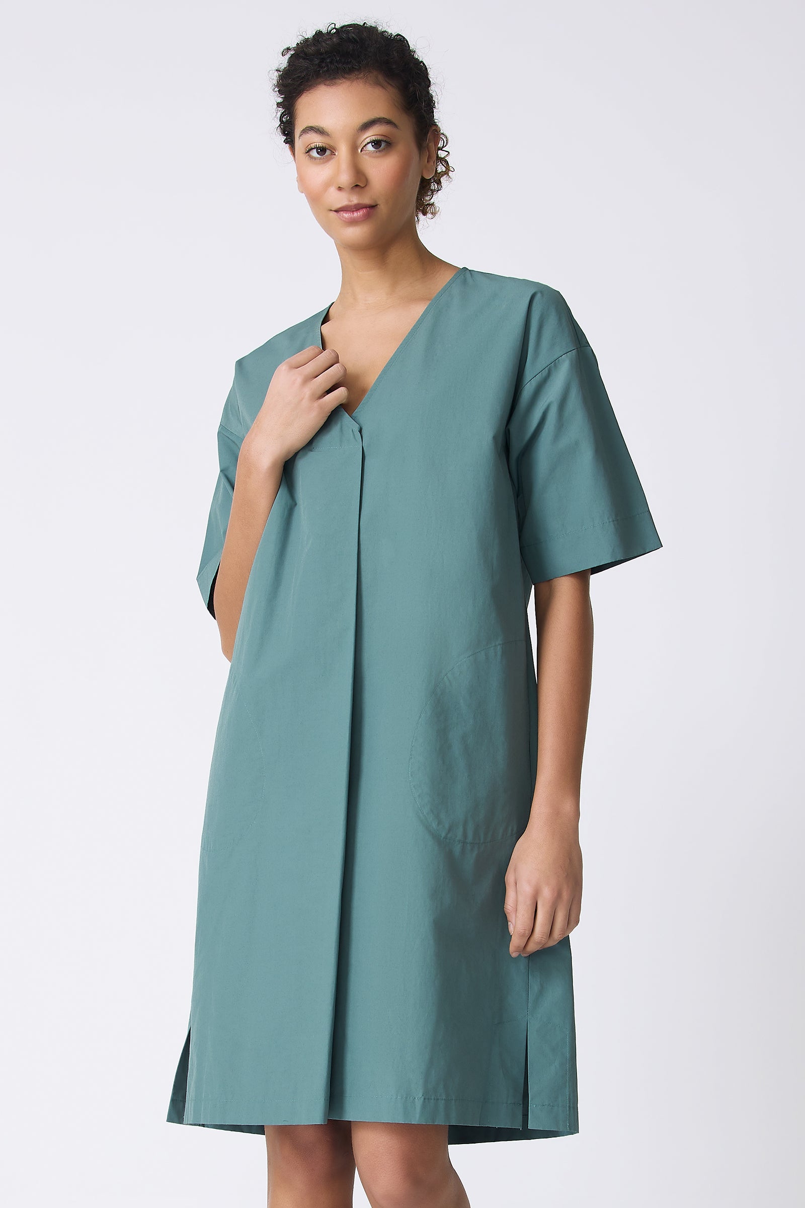 Kal Rieman Cara Fold Front Dress in Sage on model touching dress front view