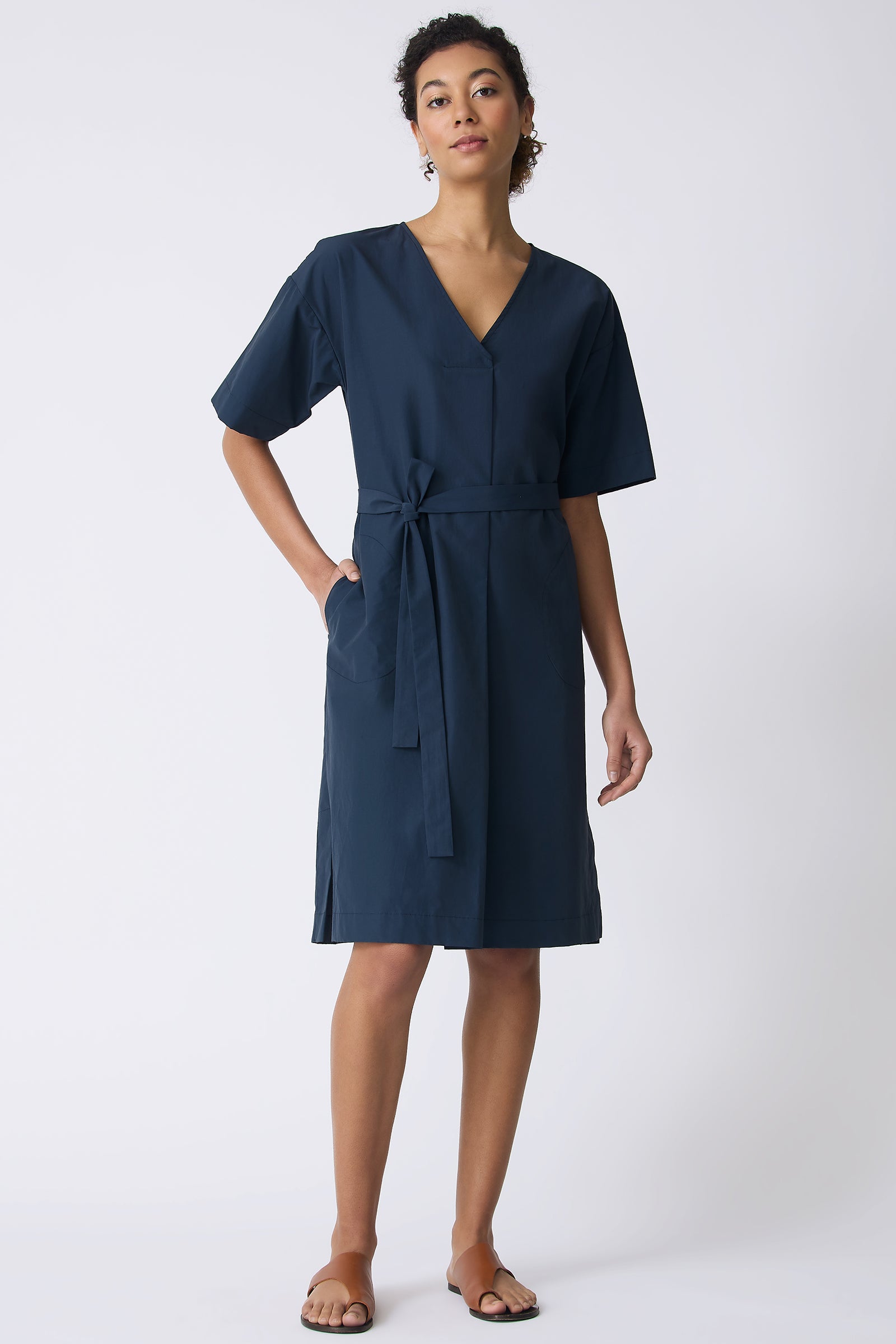 Kal Rieman Cara Fold Front Dress in Summer Navy on model with hand in pocket full front view