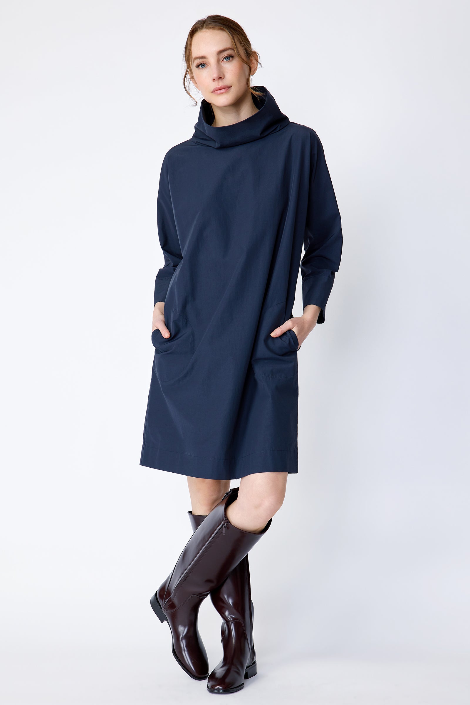 Kal Rieman Carla dress in navy Italian broadcloth on model front view legs crossed