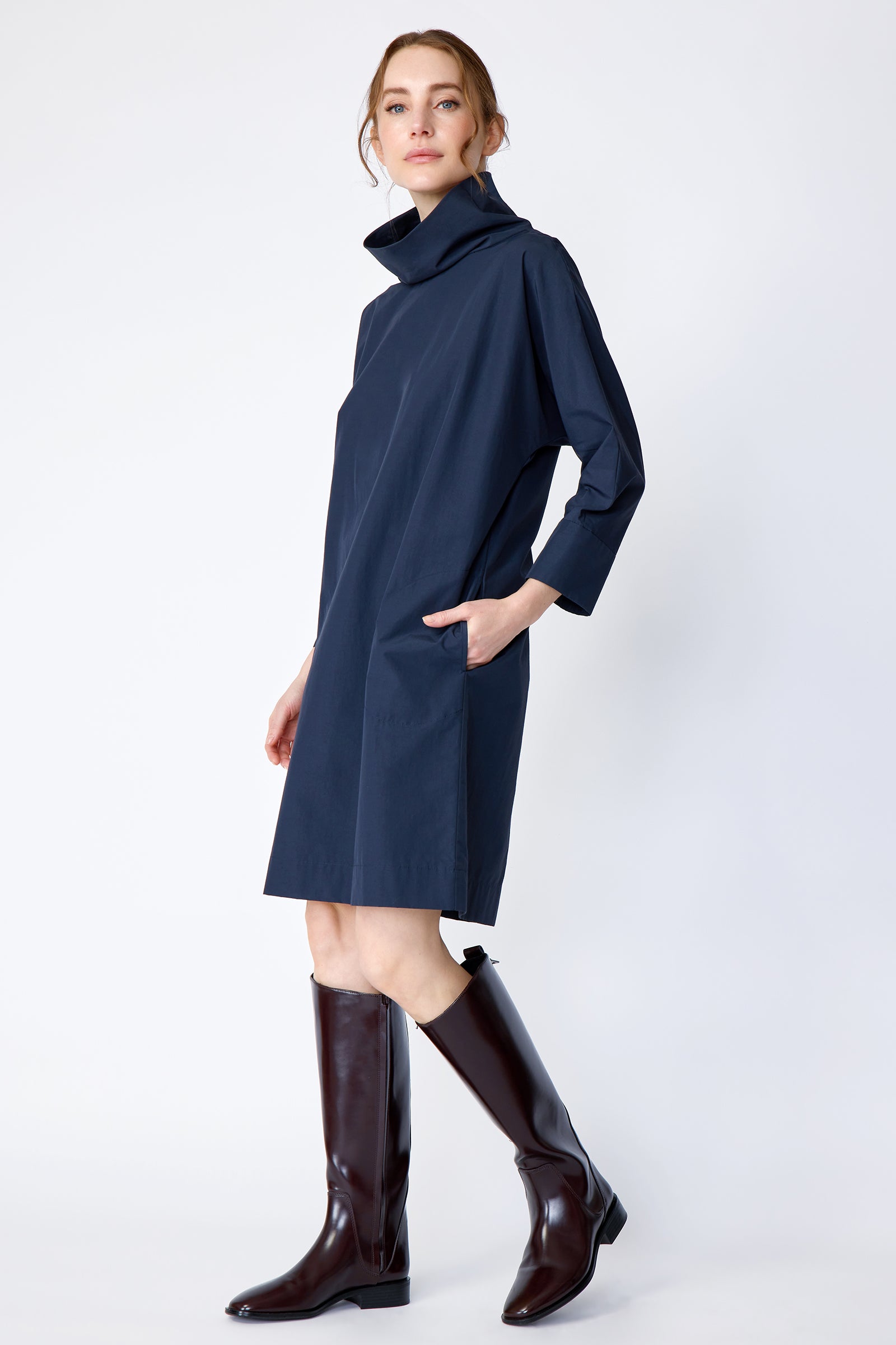 Kal Rieman Carla dress in navy Italian broadcloth on model side view walking