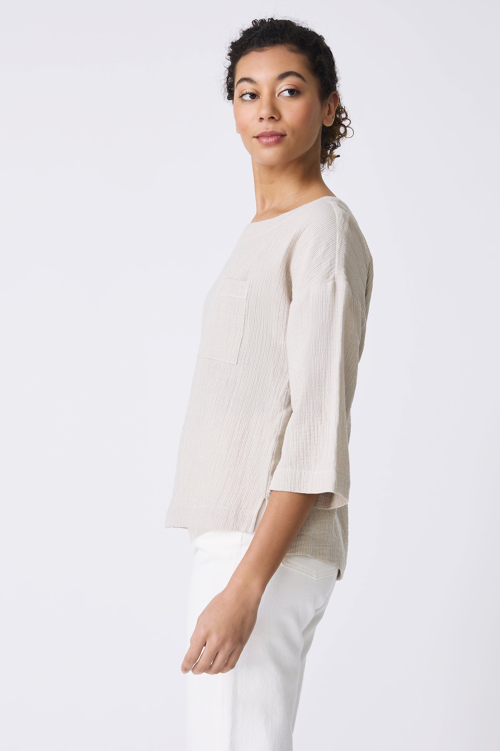 Kal Rieman Carmen Pocket Tee in Beige on model looking over shoulder side view