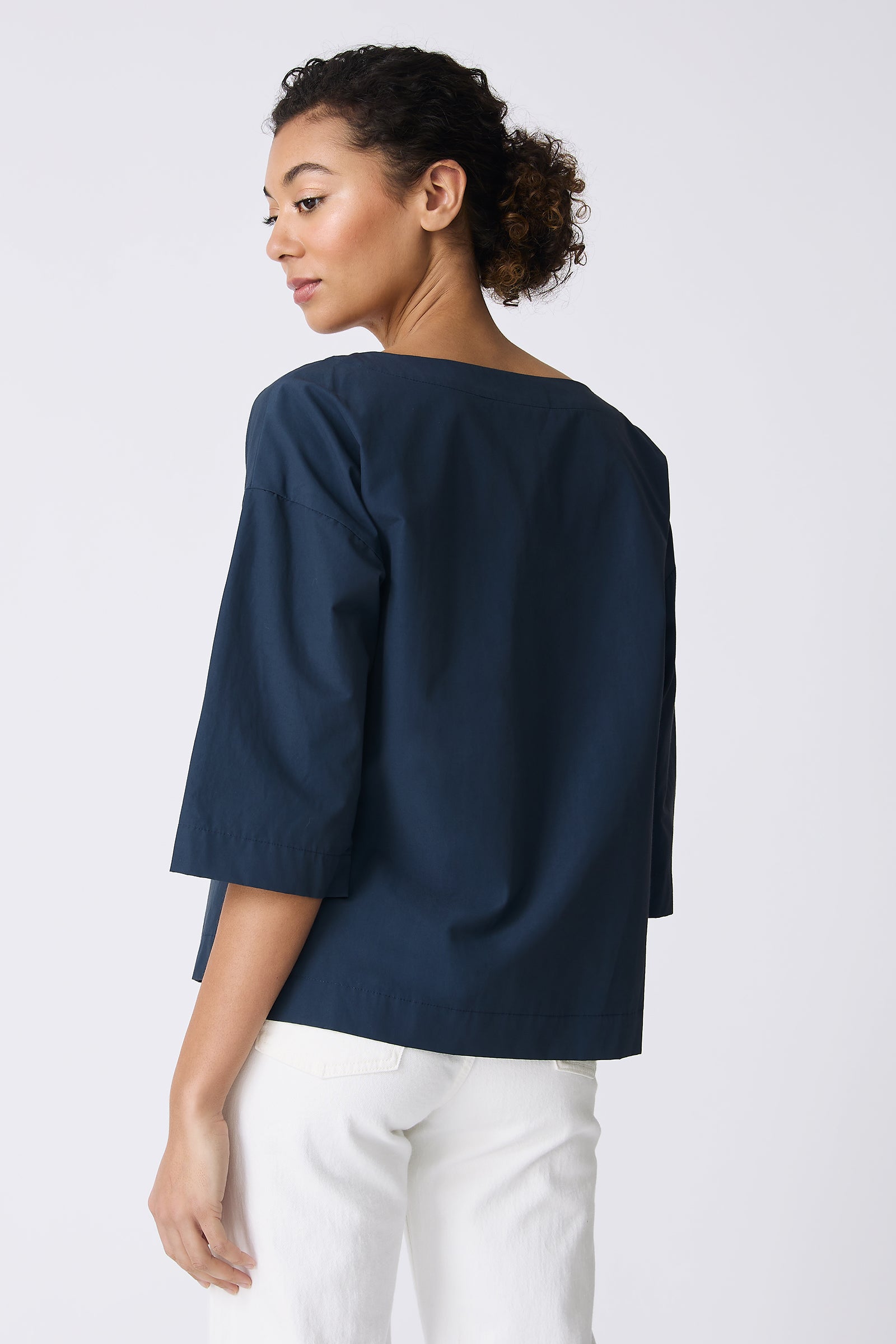 Kal Rieman Carmen Pocket Tee in Summer Navy on model with hand in back pocket front view