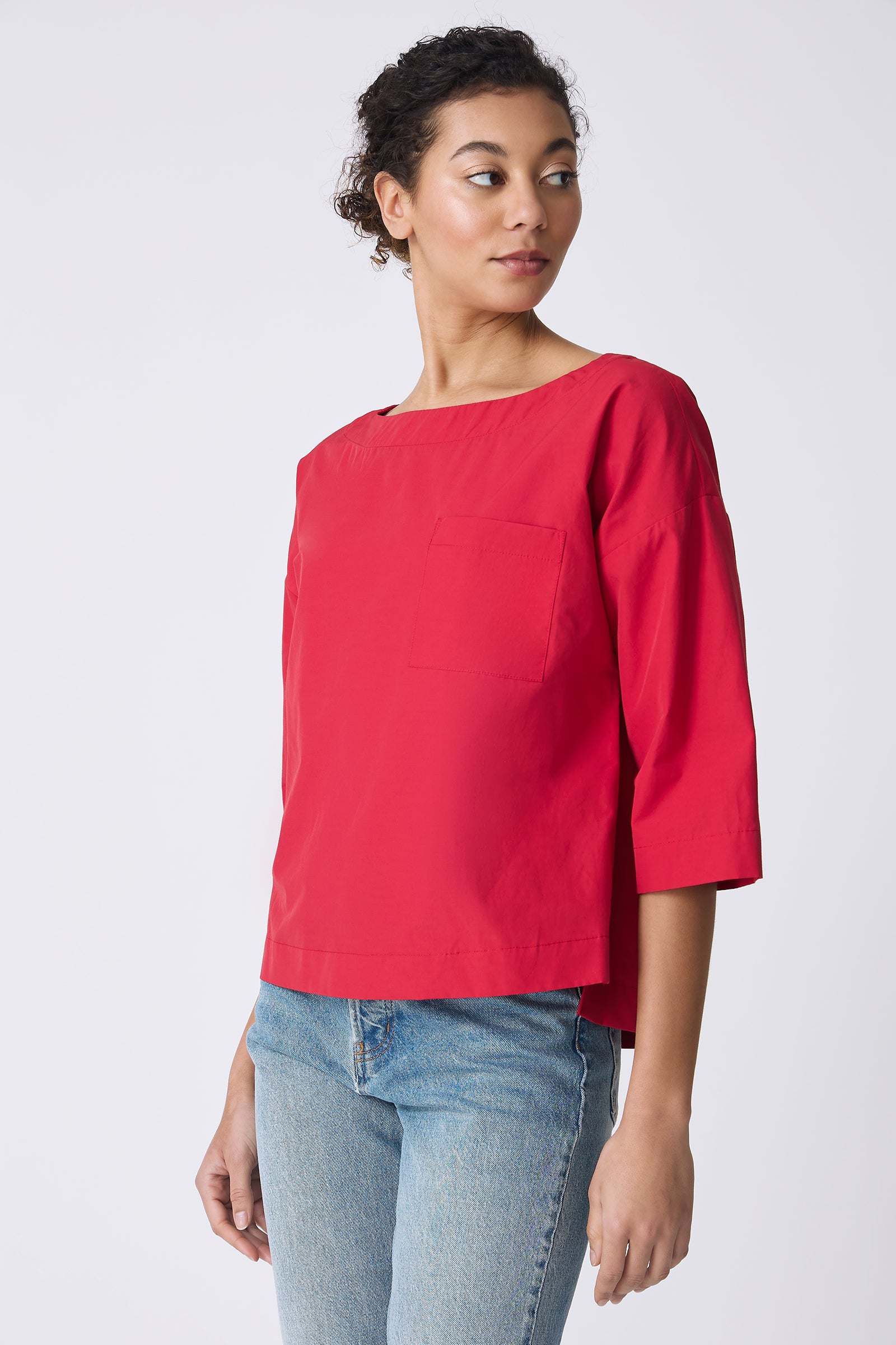 Kal Rieman Carmen Pocket Tee in Red on model looking over shoulder front view