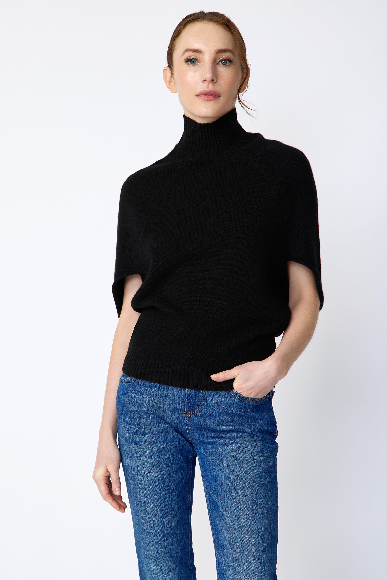 Kal Rieman Cashmere Cape Sweater in black on model front view hand in pockets