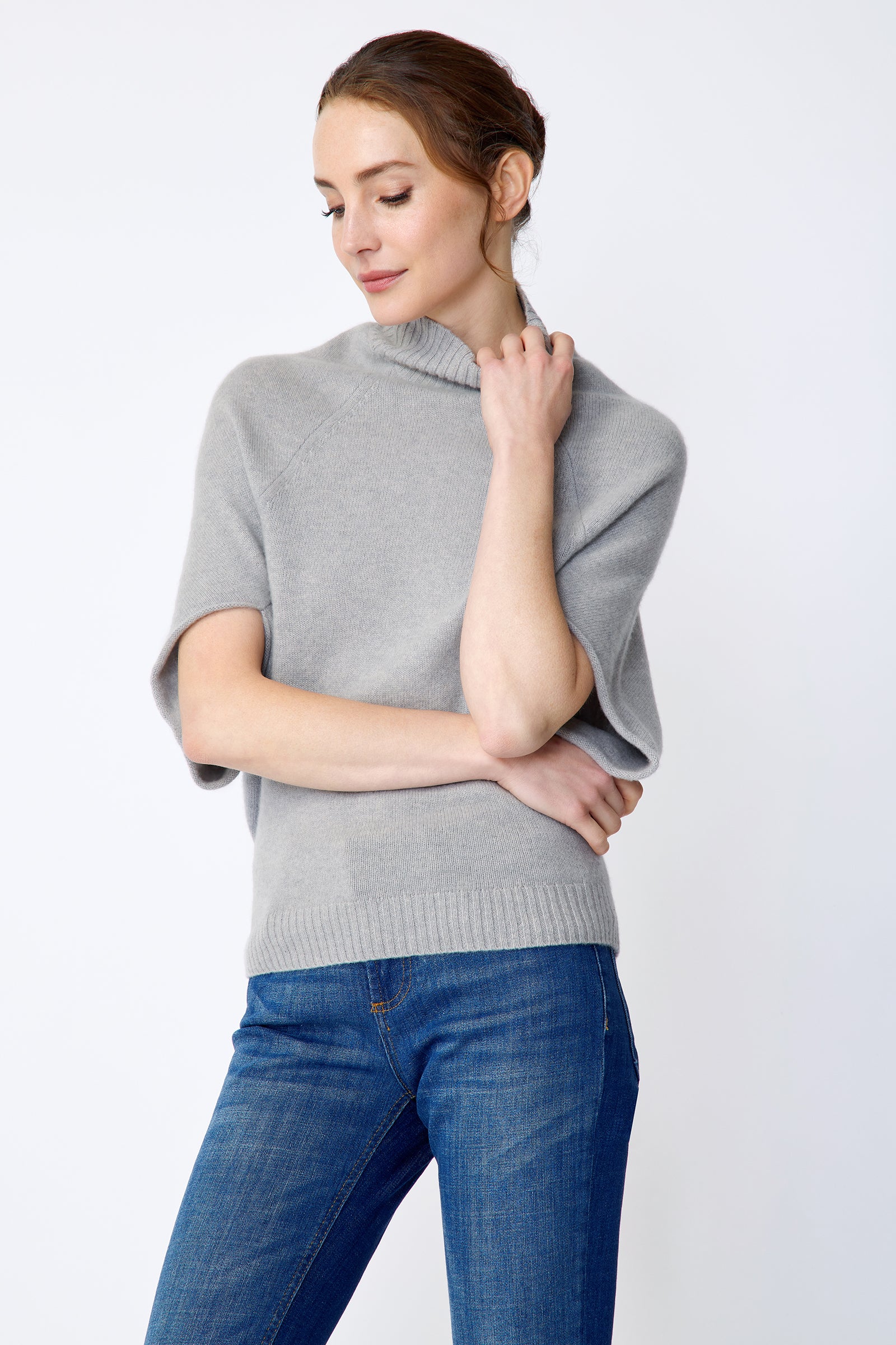Kal Rieman Cashmere Cape Sweater in grey on model side view holding collar