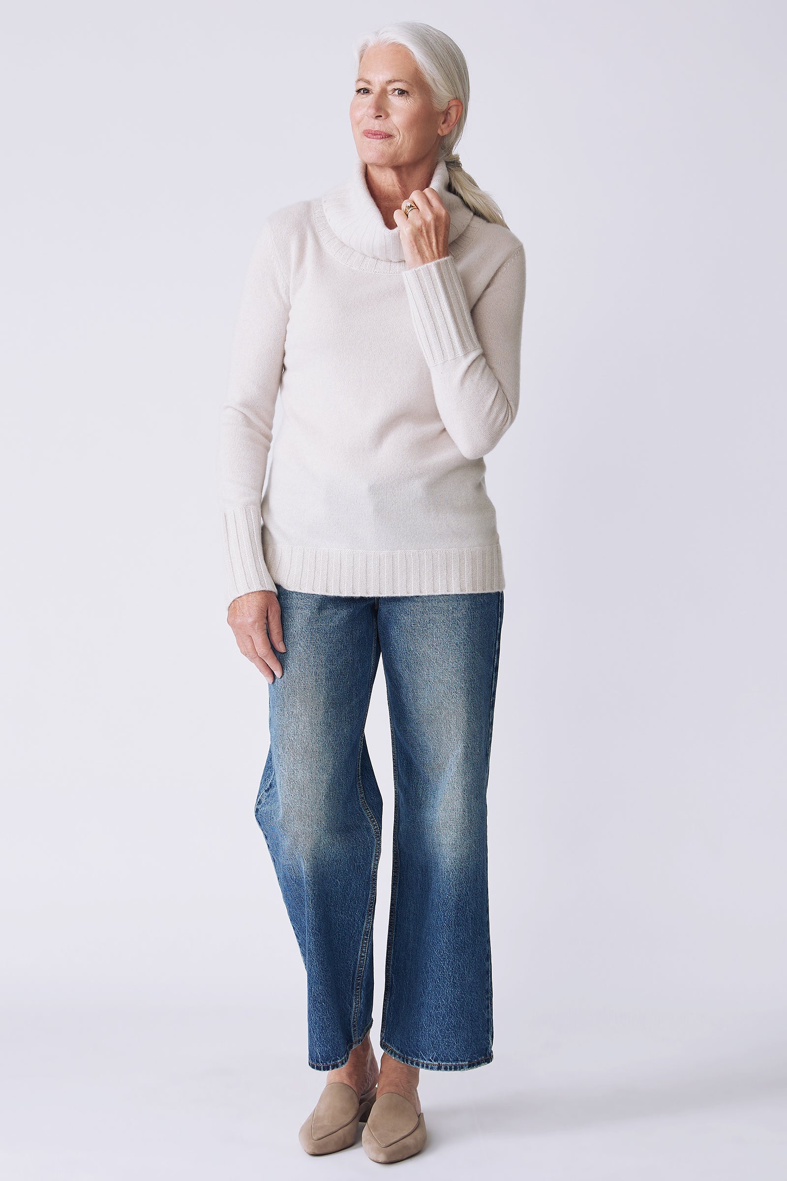 Kal Rieman Cashmere Cowl Turtleneck in haze on model front view holding collar