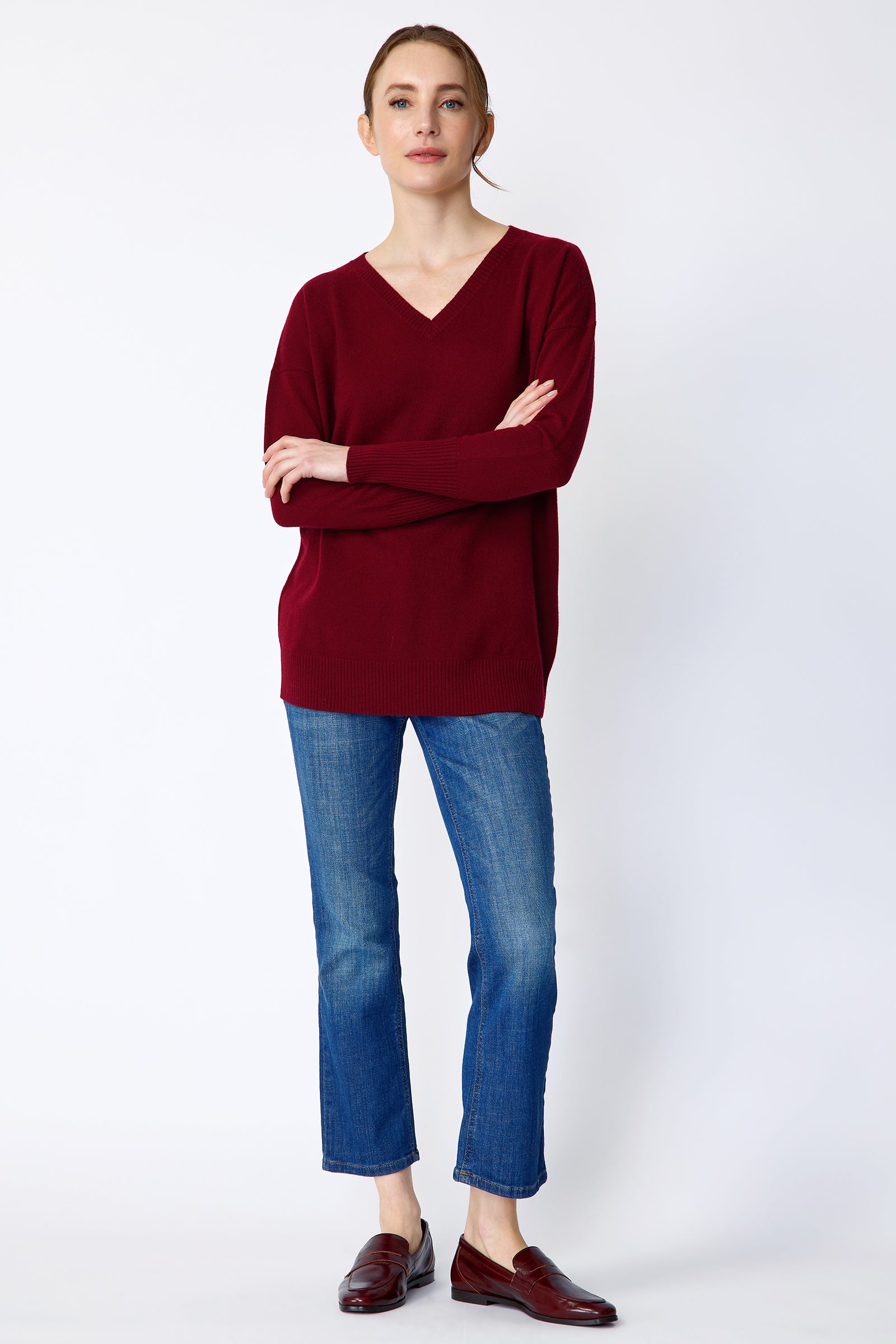 Kal Rieman Cashmere Vneck in bordeaux on model front view full length arms crossed