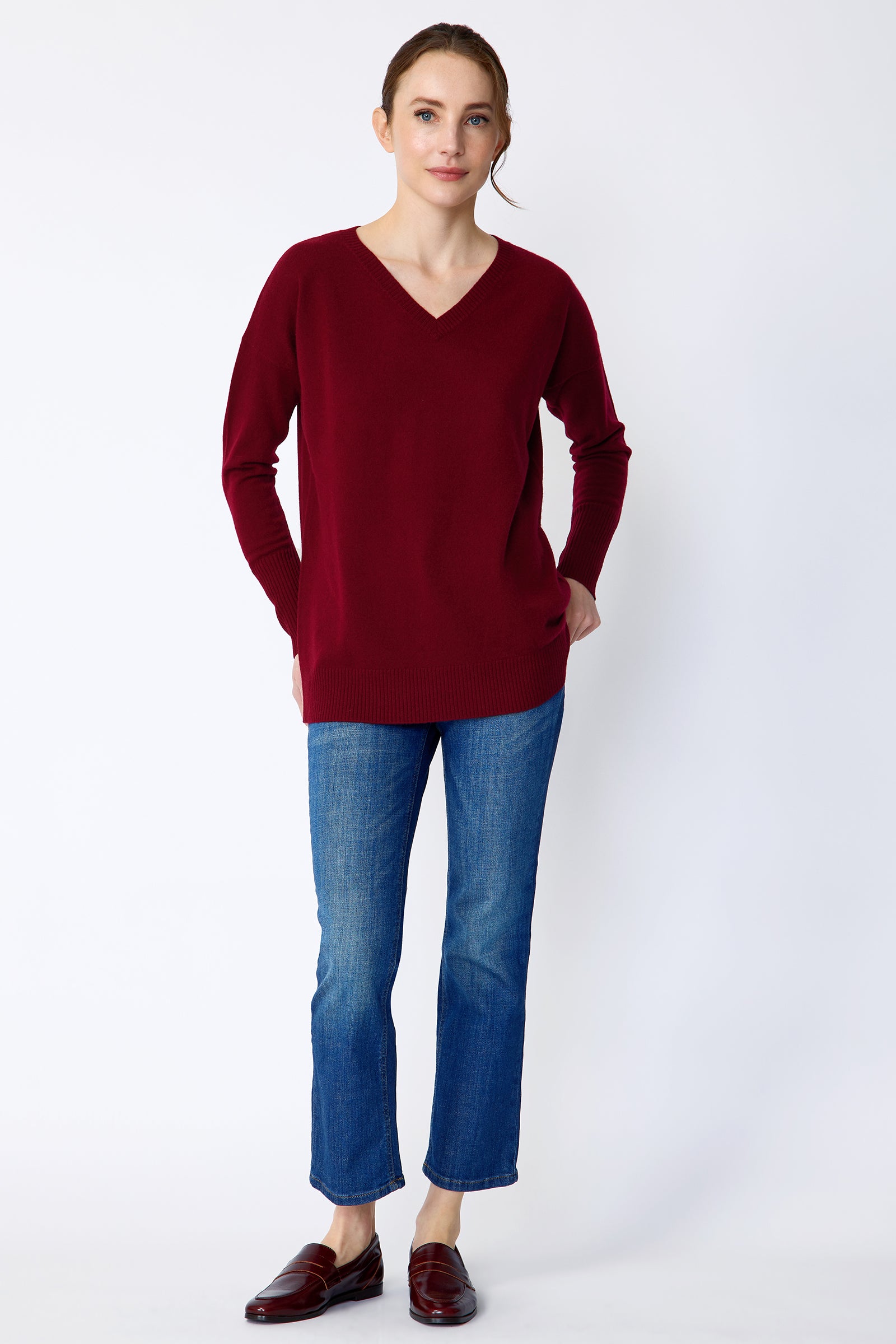 Kal Rieman Cashmere Vneck in bordeaux on model front view hands in back pockets