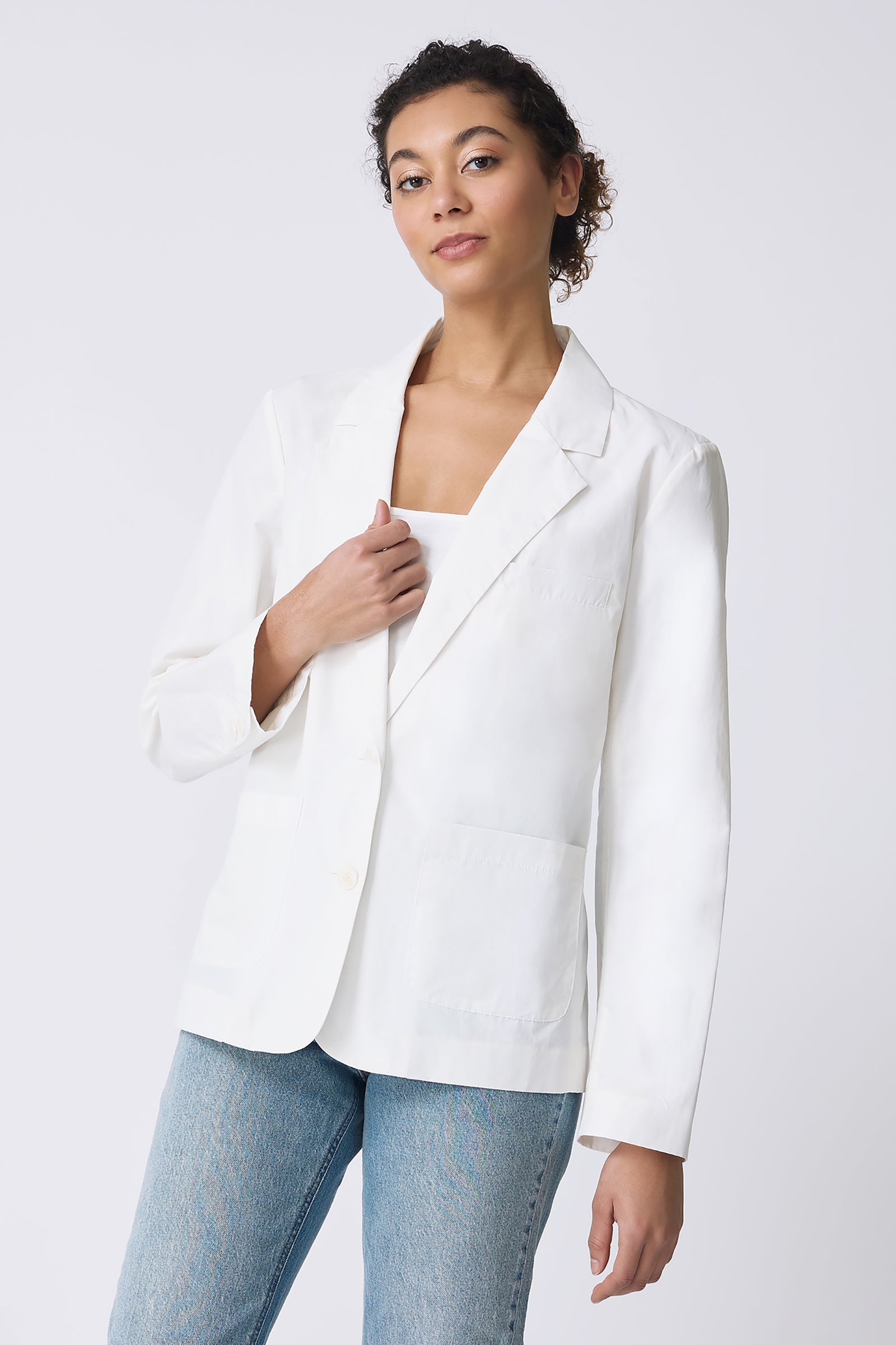Kal Rieman Castel Patch Pocket Blazer in Ecru on model touching blazer front view
