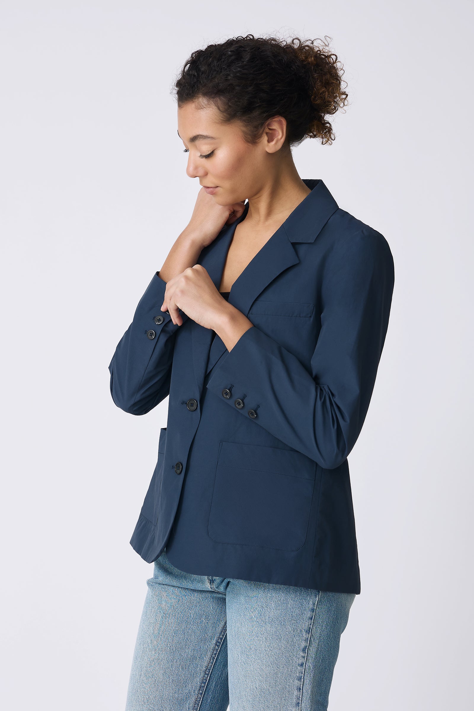Kal Rieman Castel Patch Pocket Blazer in Summer Navy on model touching wrist button side view