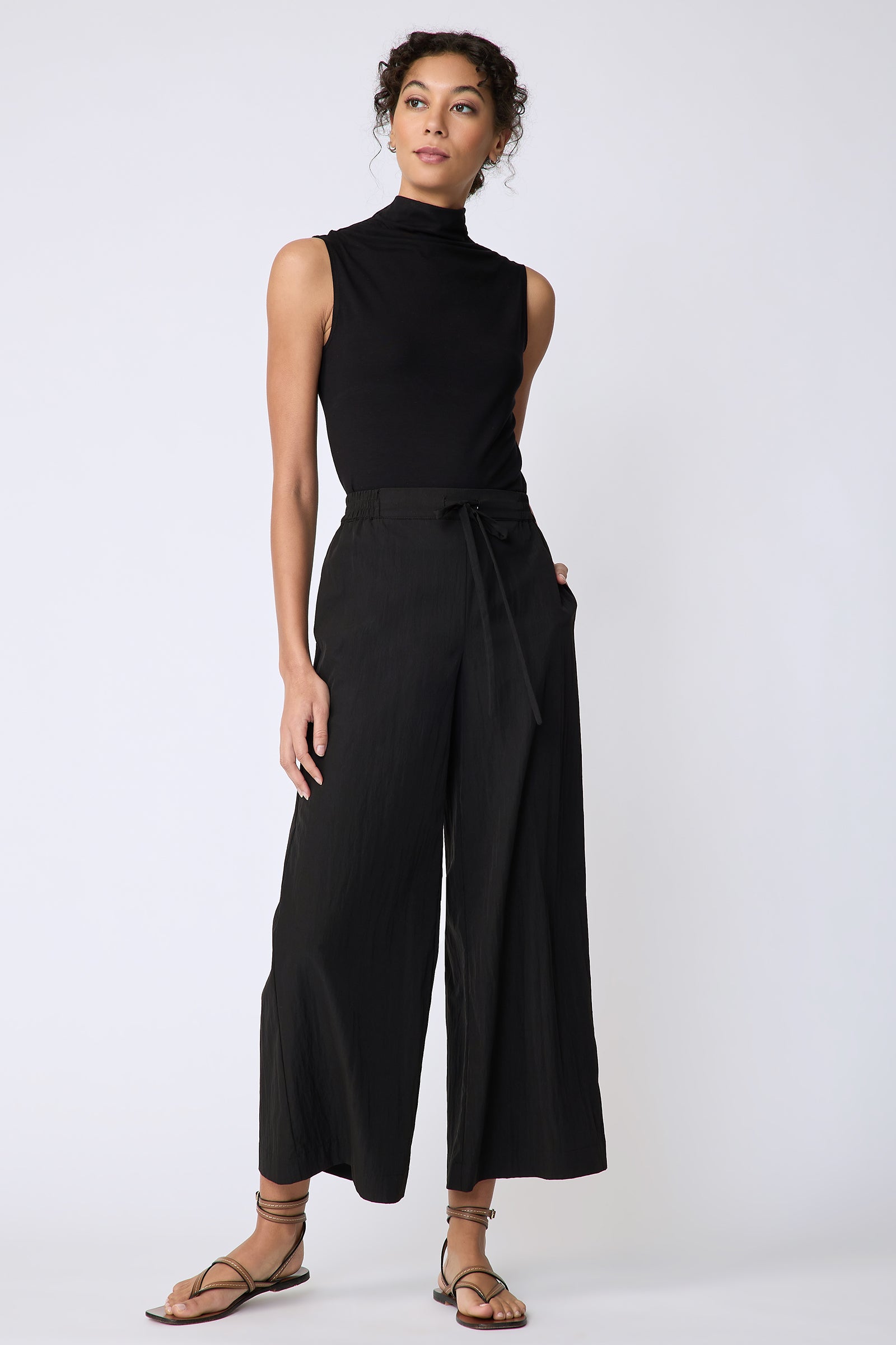 Kal Rieman Celeste Pant in black typewriter cloth on model front view hand in pocket