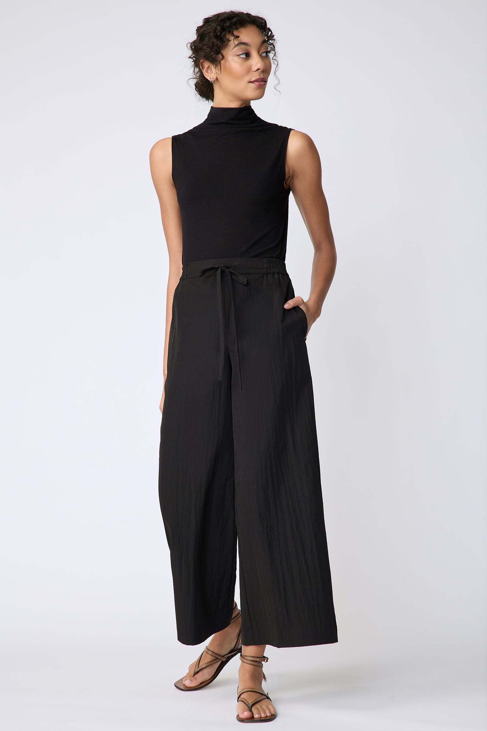 Kal Rieman Celeste Pant in black typewriter cloth on model front view walking