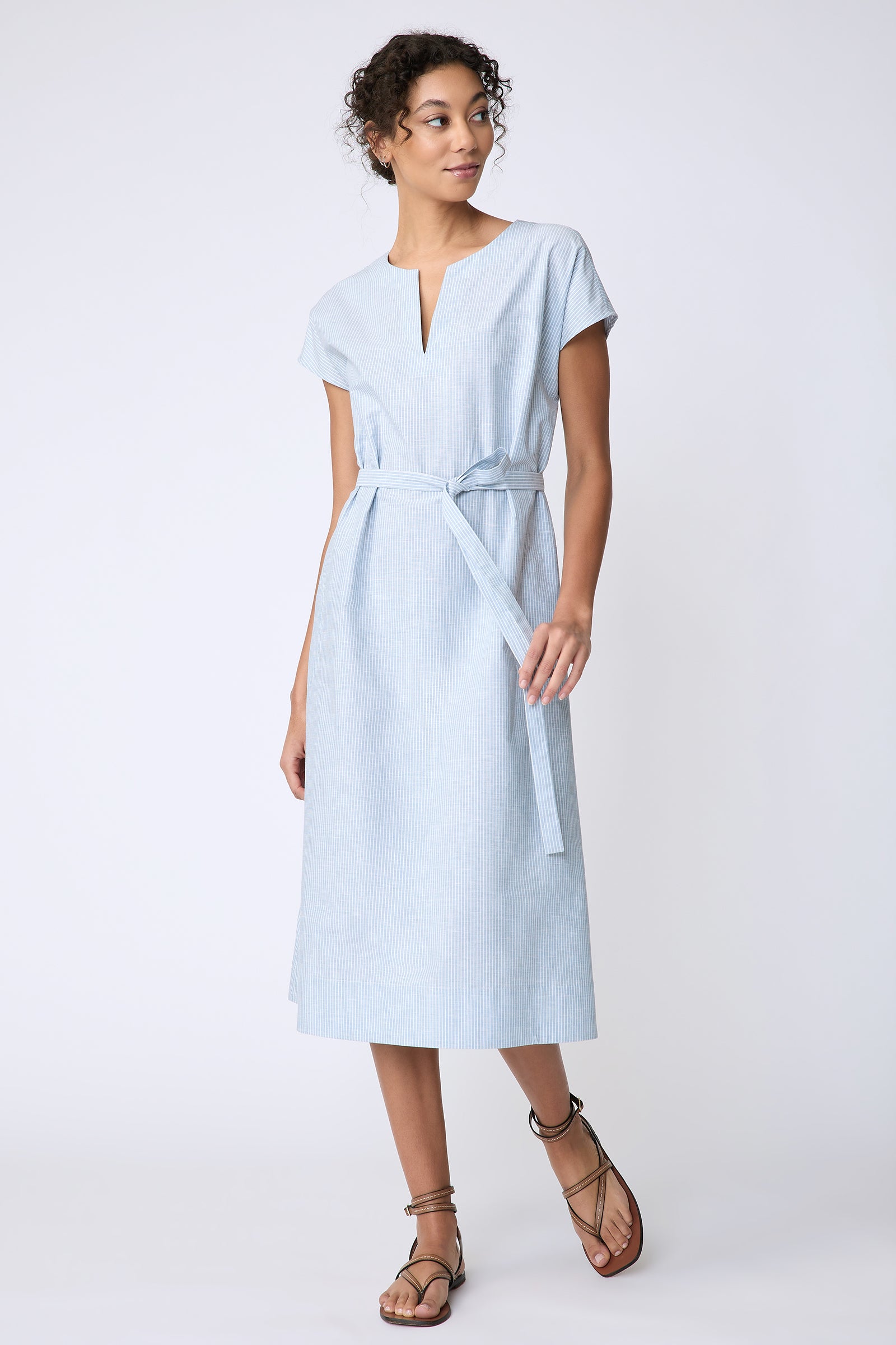 Kal Rieman Clara Dress in light blue mini stripe on model front view walking
