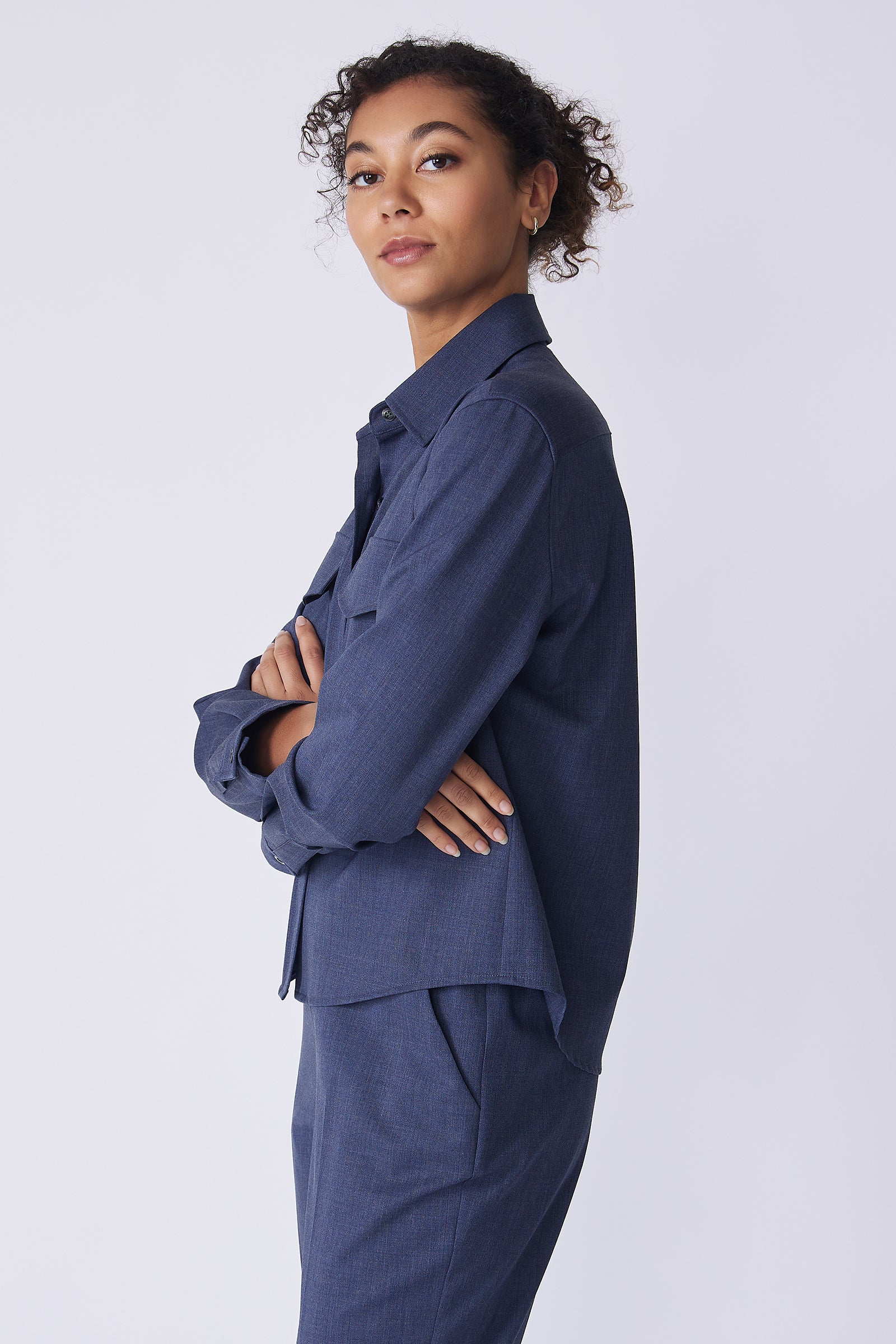 Kal Rieman Crop Tailored Shirt in denim suiting on model side view arms crossed