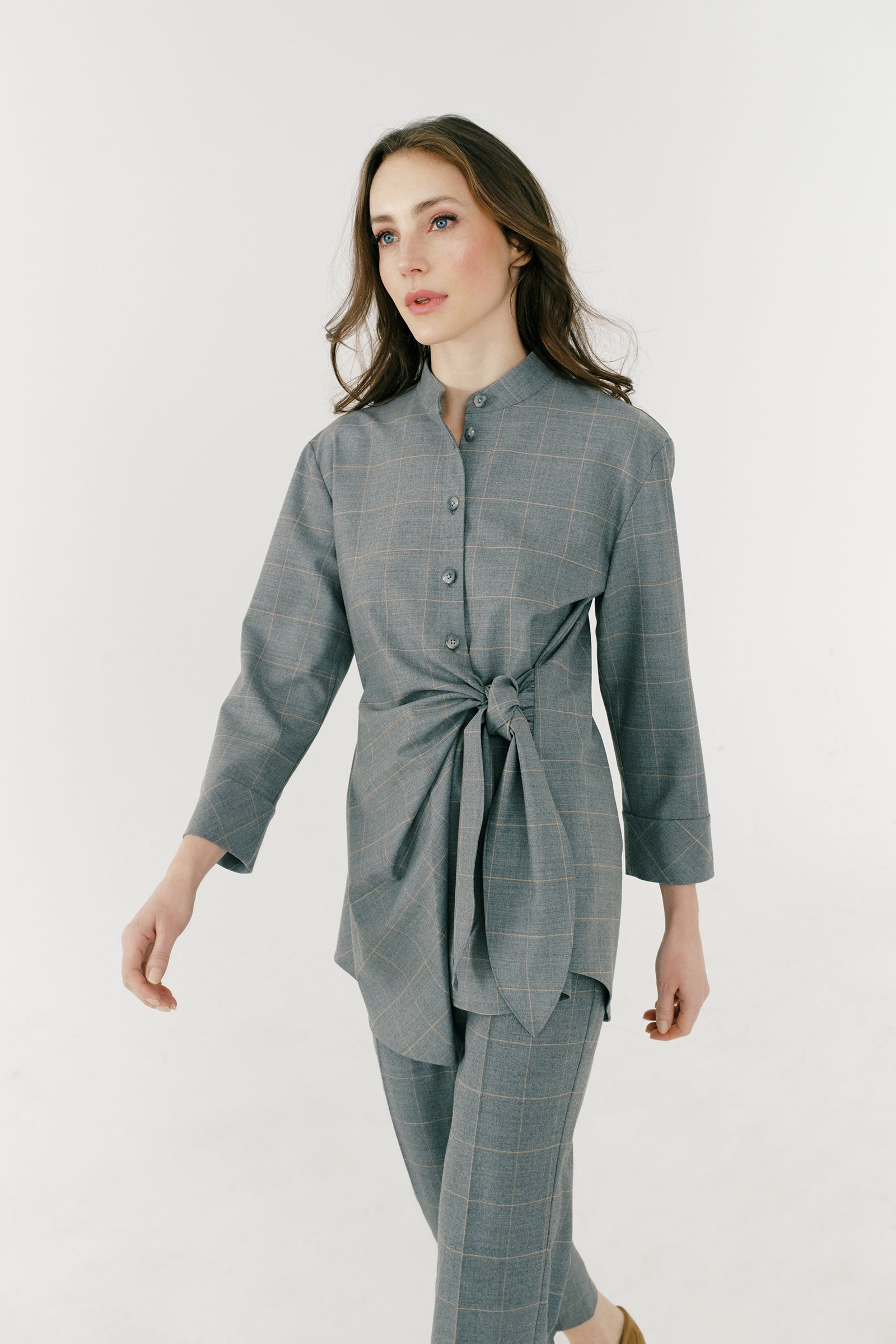 Kal Rieman Cynthia Wrap Top in Italian windowpane on model front view detail walking
