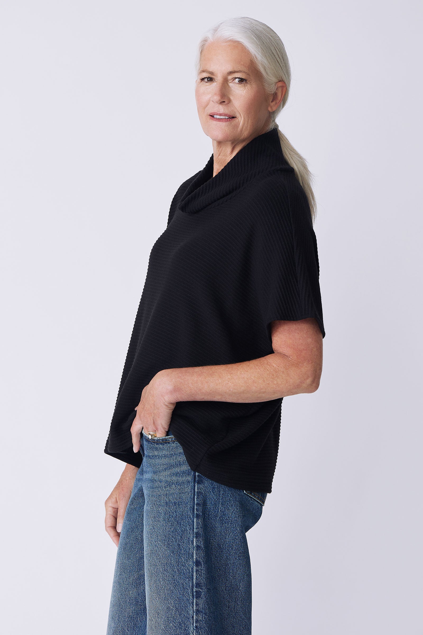 Kal Rieman Dafne Cowl Rib T-Neck in black on model side view hand in pocket