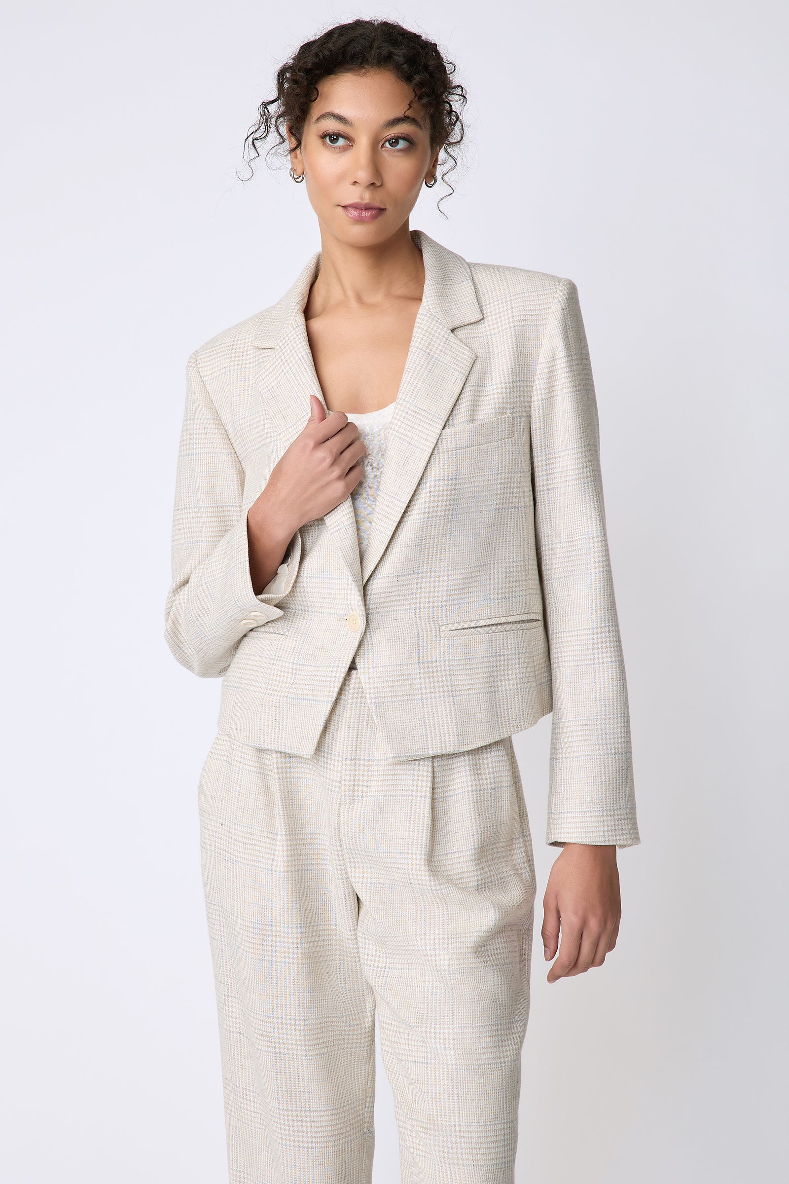 Kal Rieman Dakota Blazer in Italian Summer Plaid on model side view holding lapel looking to the side