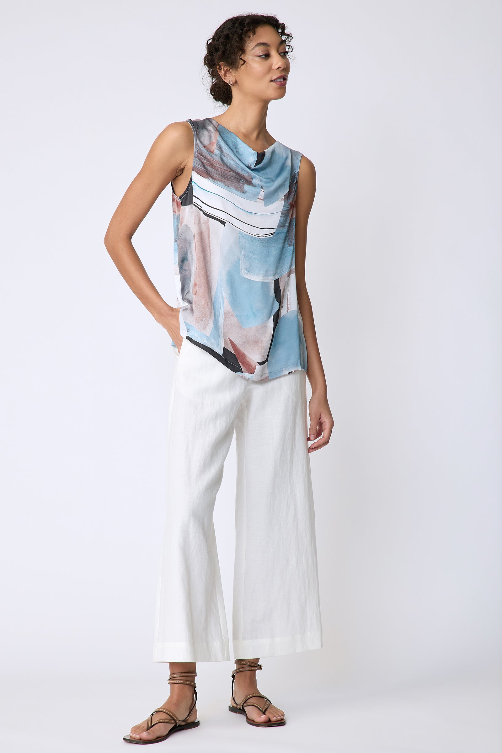 Kal Rieman Dani Drape Top in Sante Fe blue print on model front view hand in pocket