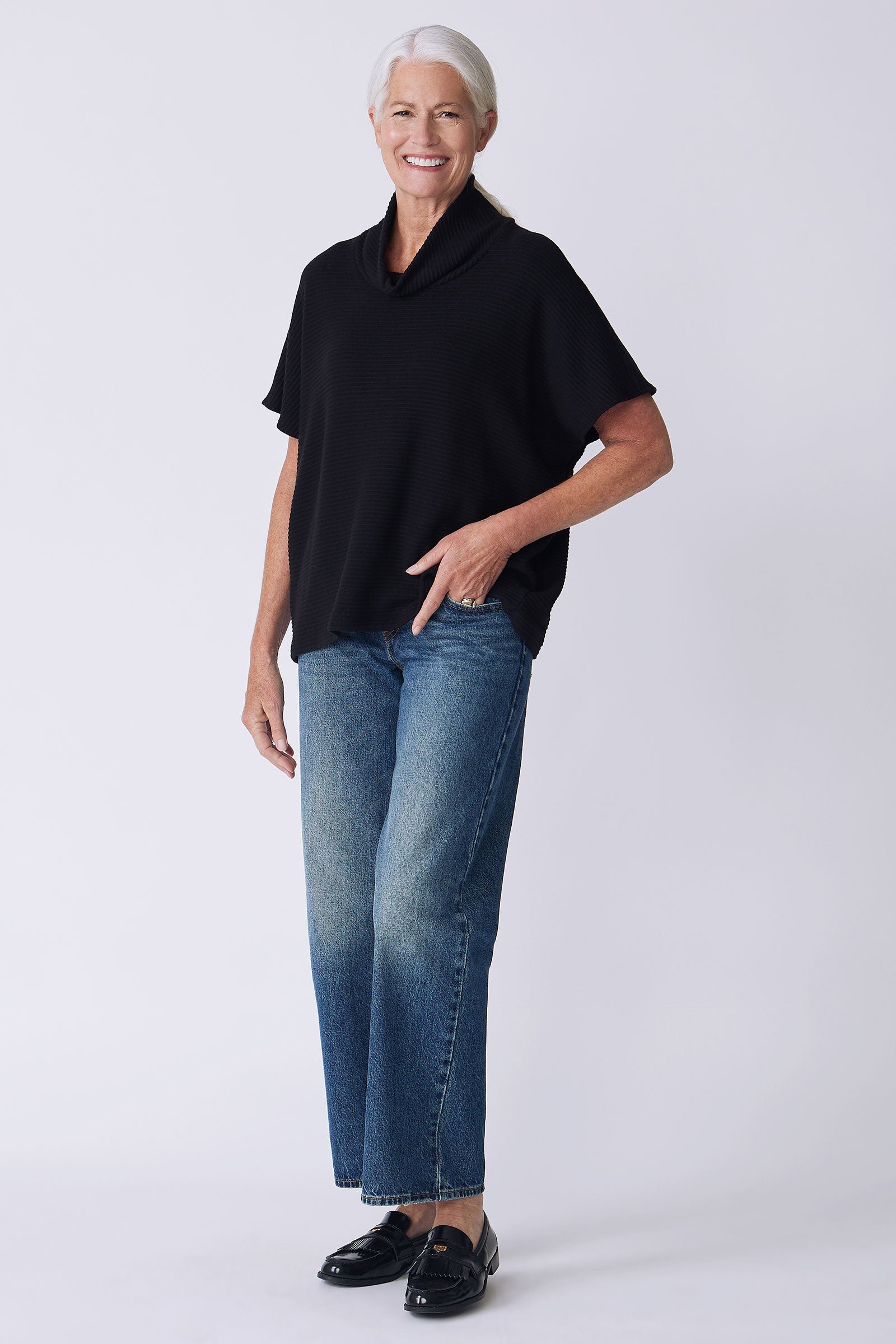 Kal Rieman Dafne Cowl Rib T-Neck in black on model front view full look hand in pocket