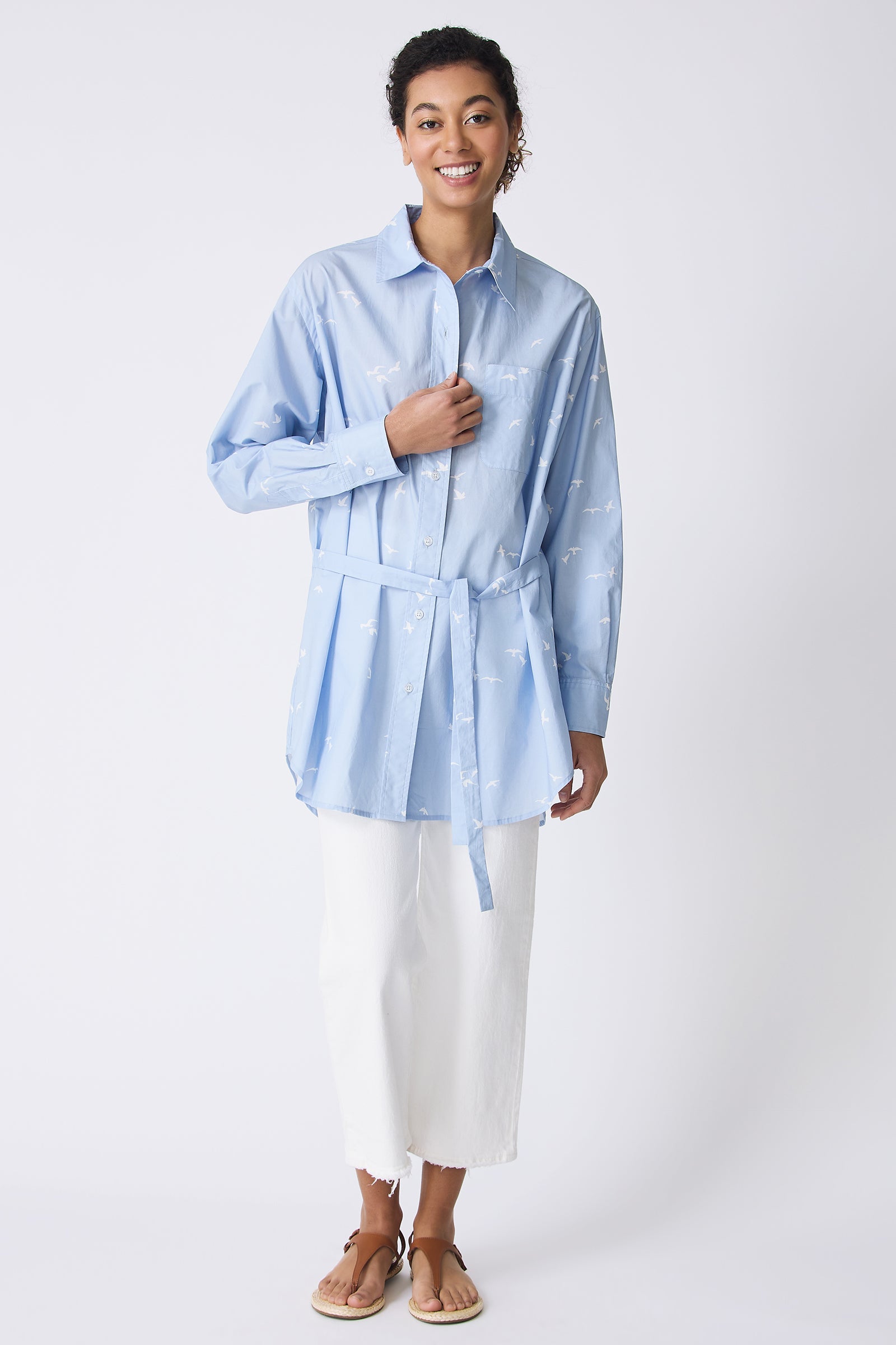 Kal Rieman Deanna Shirt in Oxford Blue Bird Print on model touching button full front view