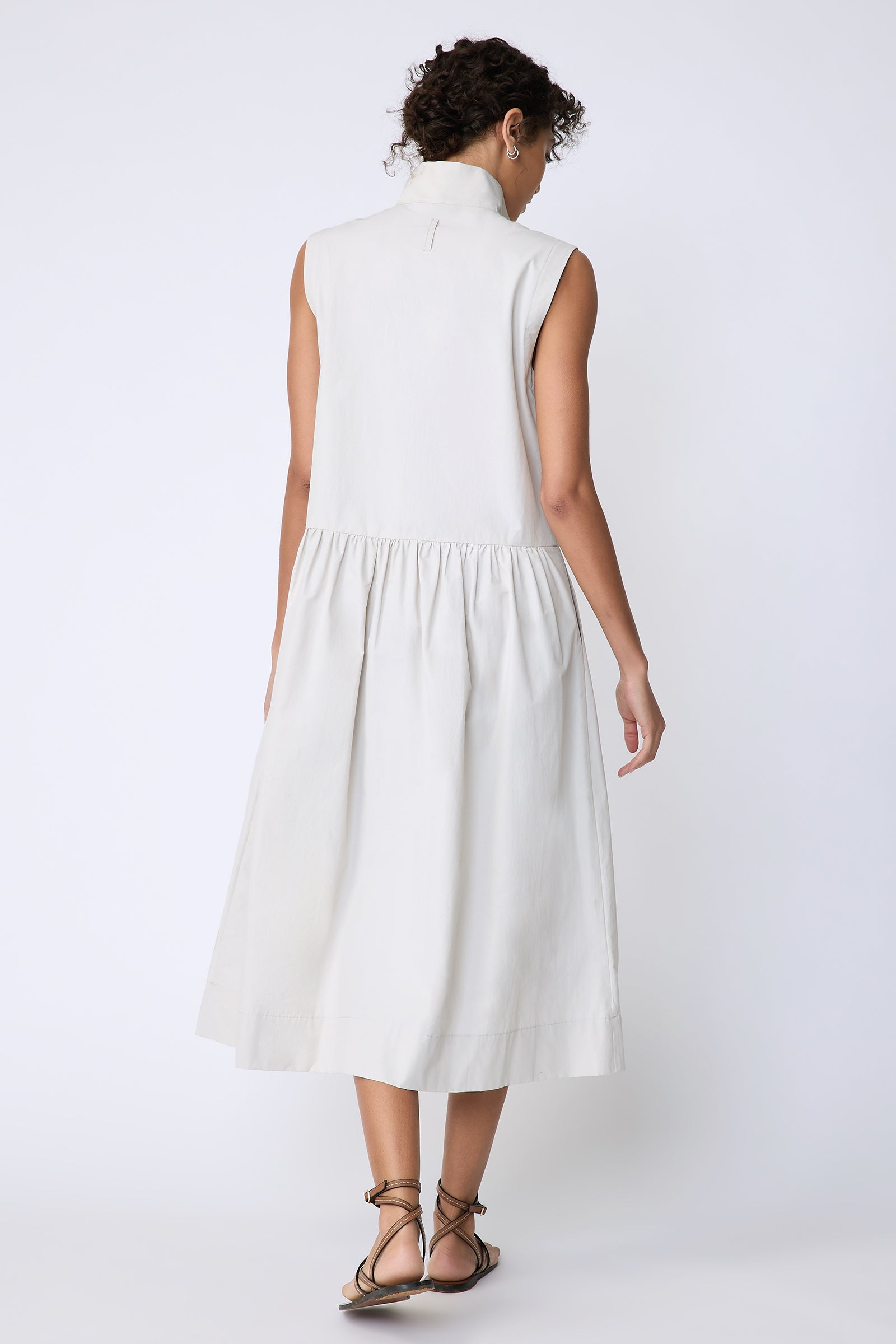 Kal Rieman Demi Dress in Italian Broadcloth stone color on model back view walking