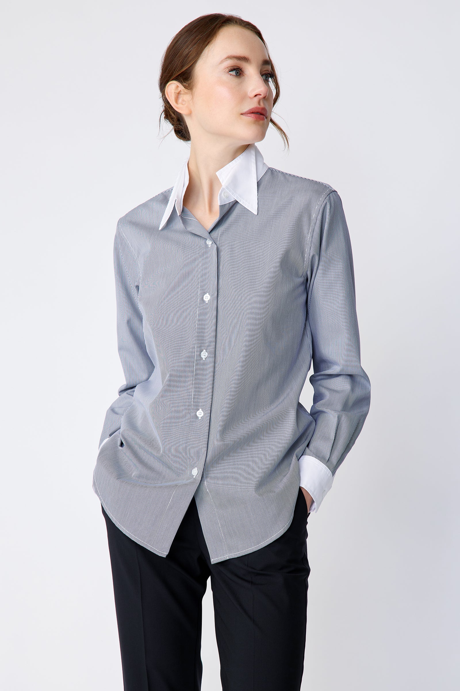 Kal Rieman Double Collar Shirt in Mini Stripe with white collar and cuffs on model Front view hands in Pockets looking to the side